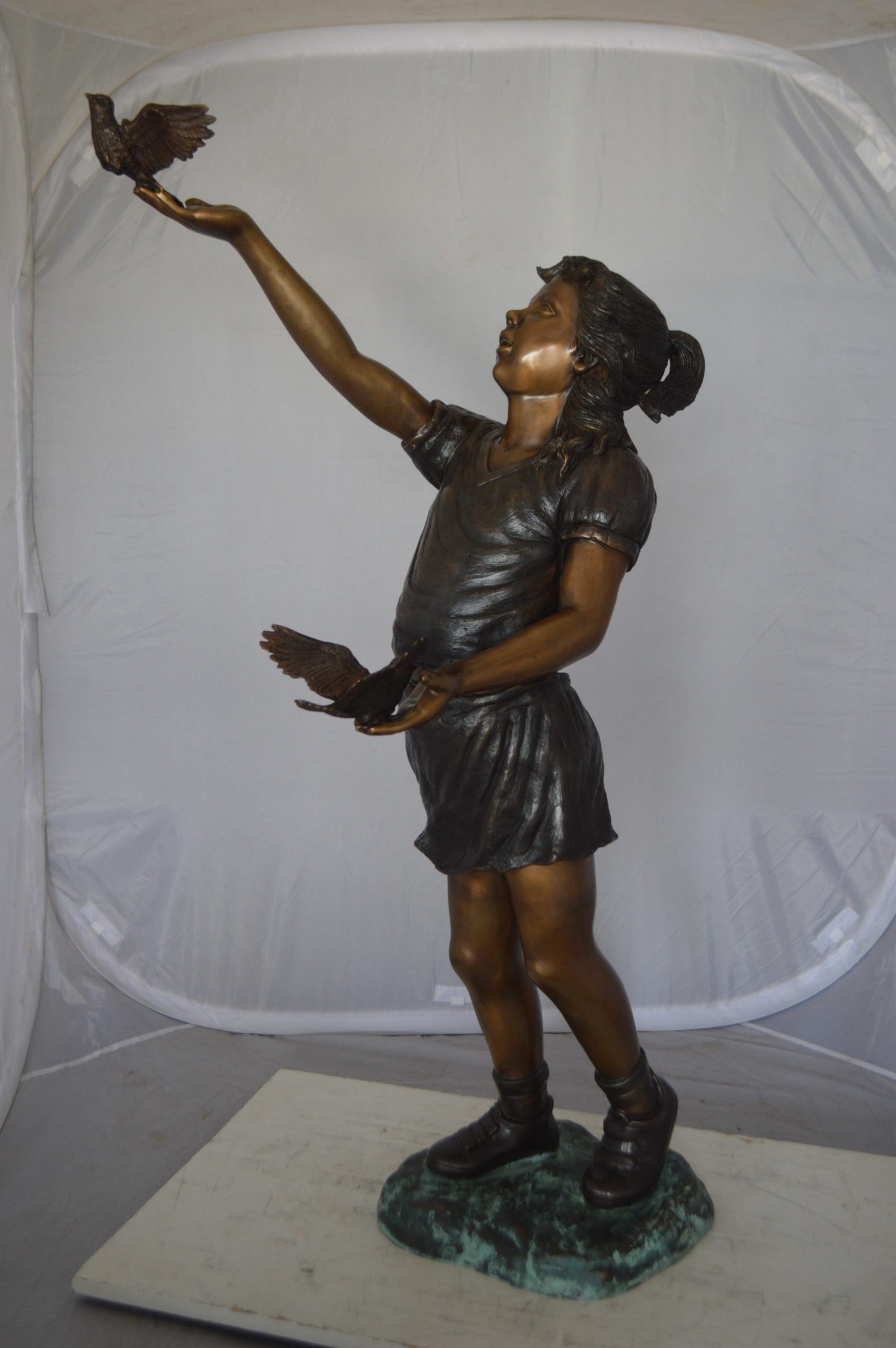 Girl - sandy, with two birds Bronze Statue - Size: 25"L x 20"W x 42"H.