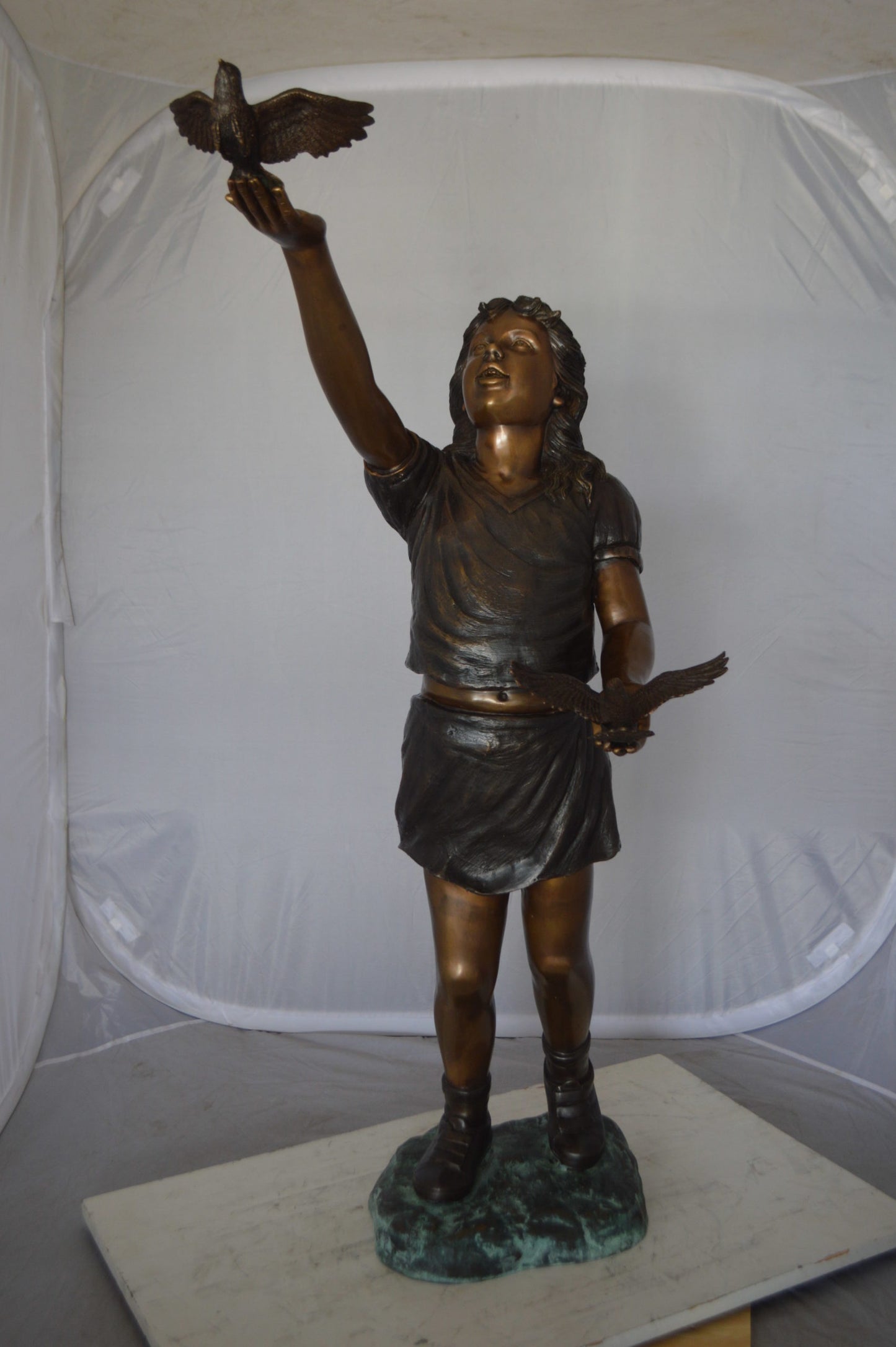 Girl - sandy, with two birds Bronze Statue - Size: 25"L x 20"W x 42"H.