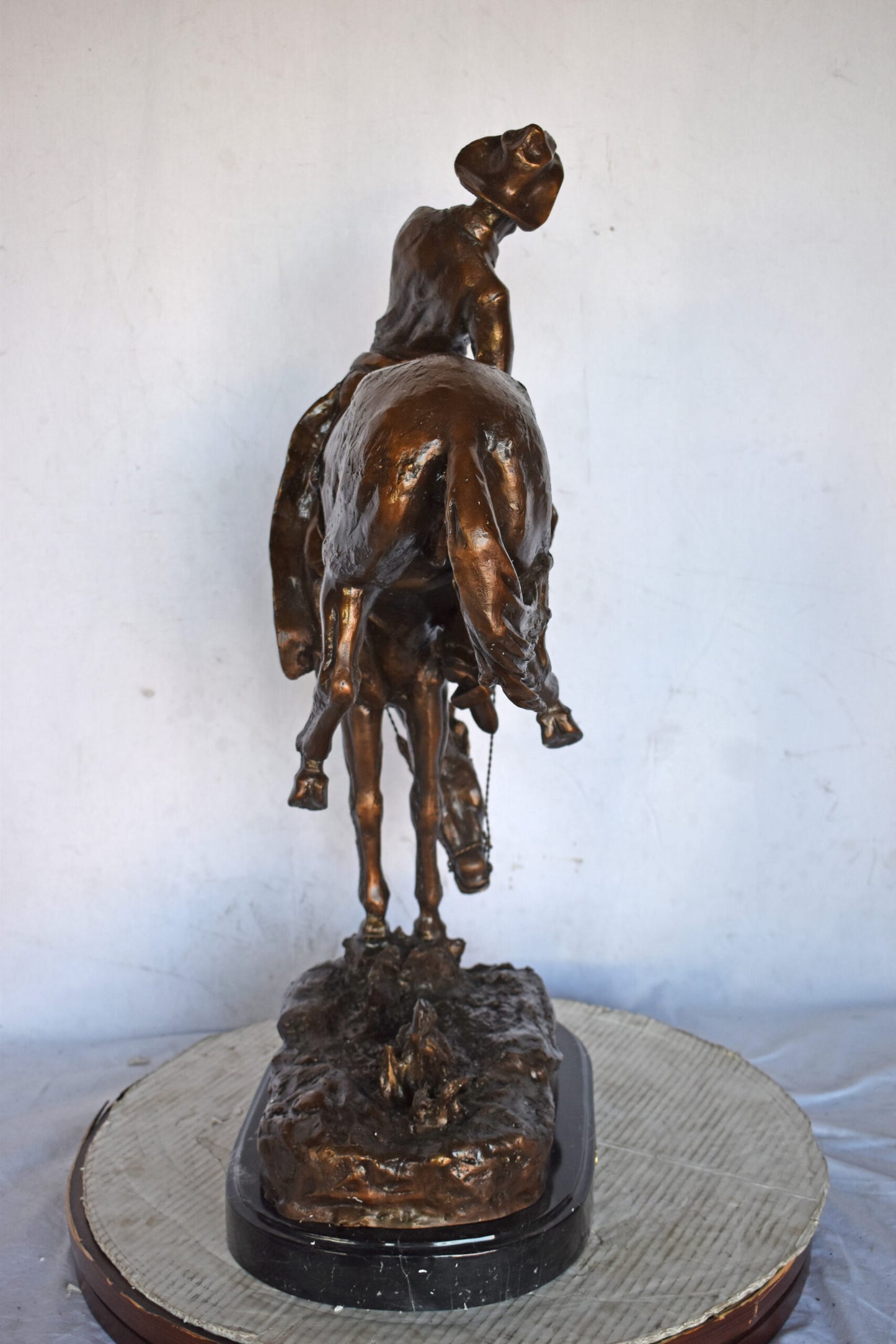 Outlaw by Remington Bronze Statue Replica - Size: 18"L x 10"W x 32"H.