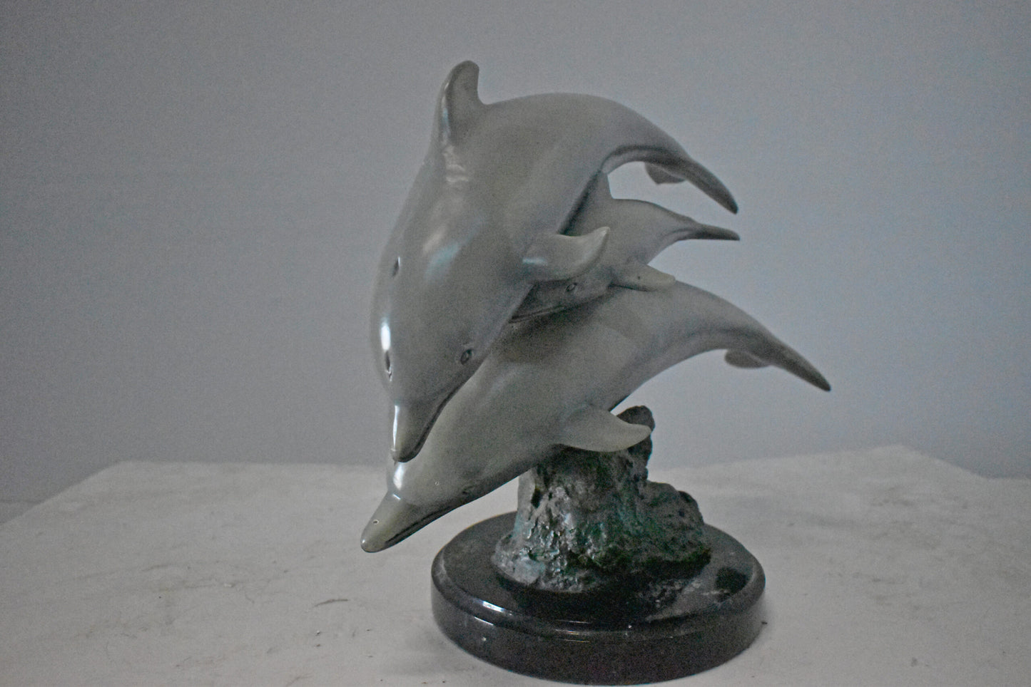 Three Grey Dolphins Swimming Bronze Statue on Marble - Size: 16"L x 9"W x 13"H.
