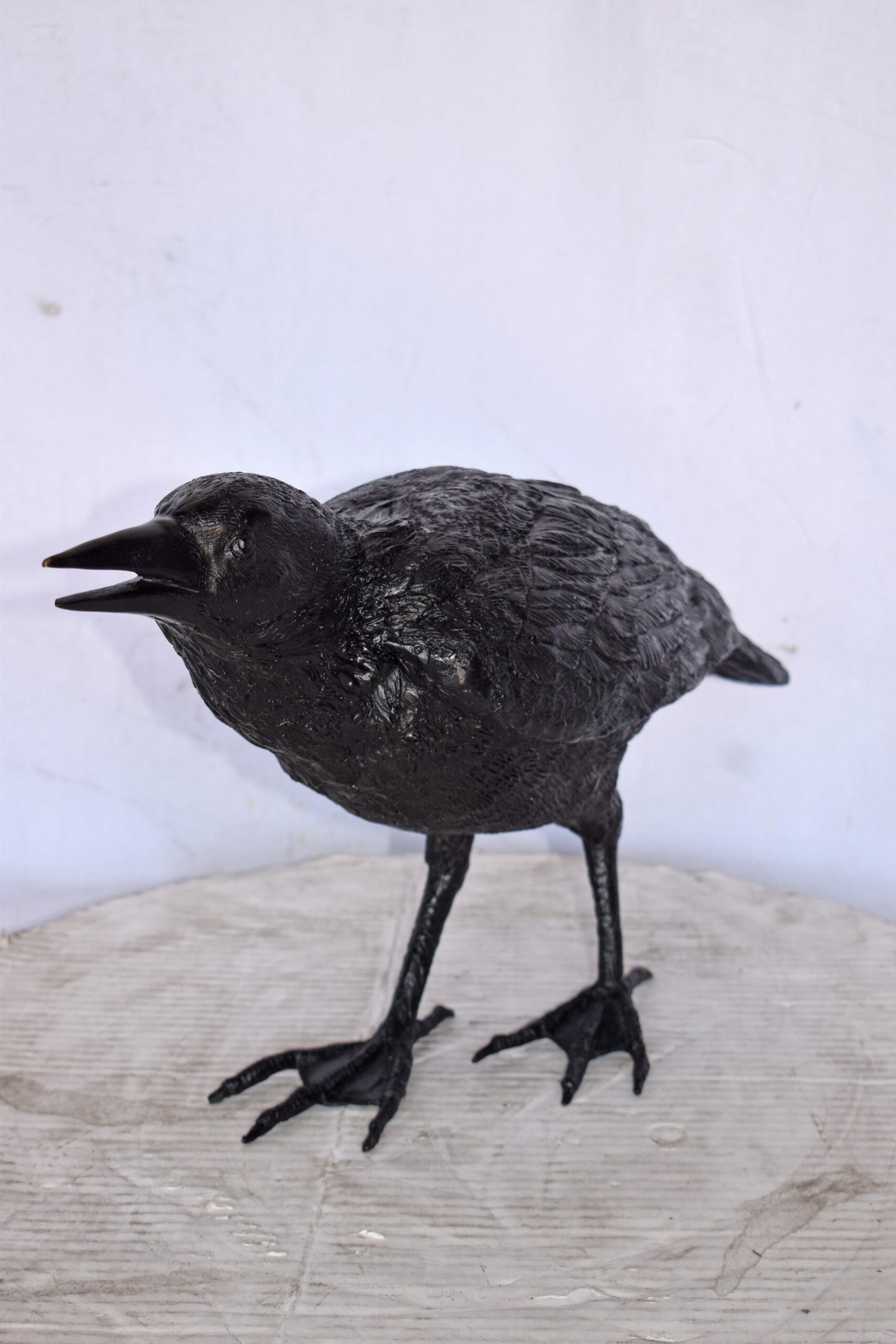 Raven Watching Forward Bronze State - Size: 22"L x 5"W x 7"H.