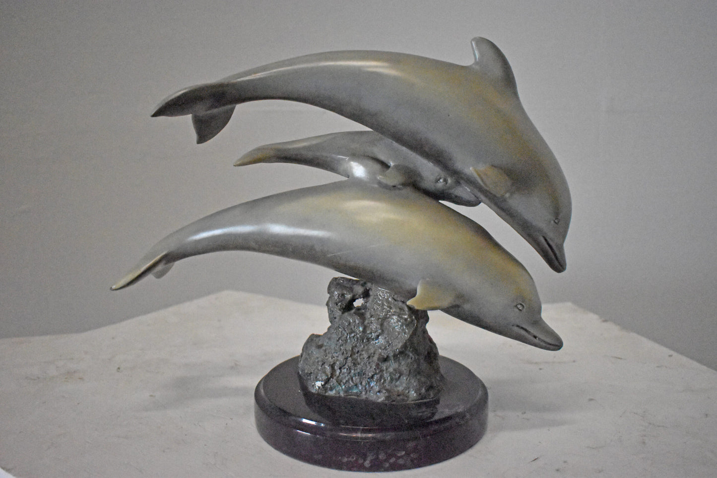 Three Grey Dolphins Swimming Bronze Statue on Marble - Size: 16"L x 9"W x 13"H.