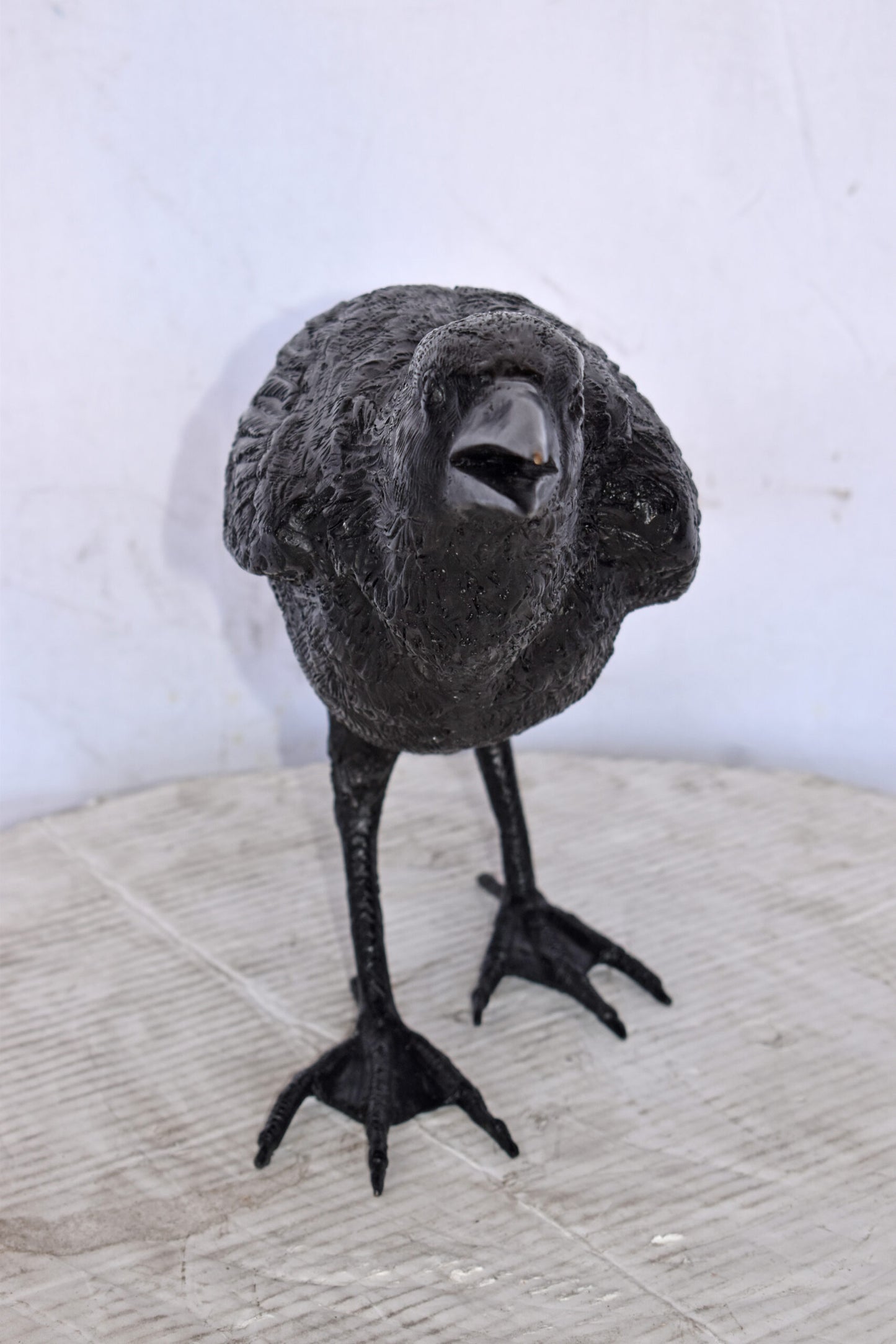 Raven Watching Forward Bronze State - Size: 22"L x 5"W x 7"H.