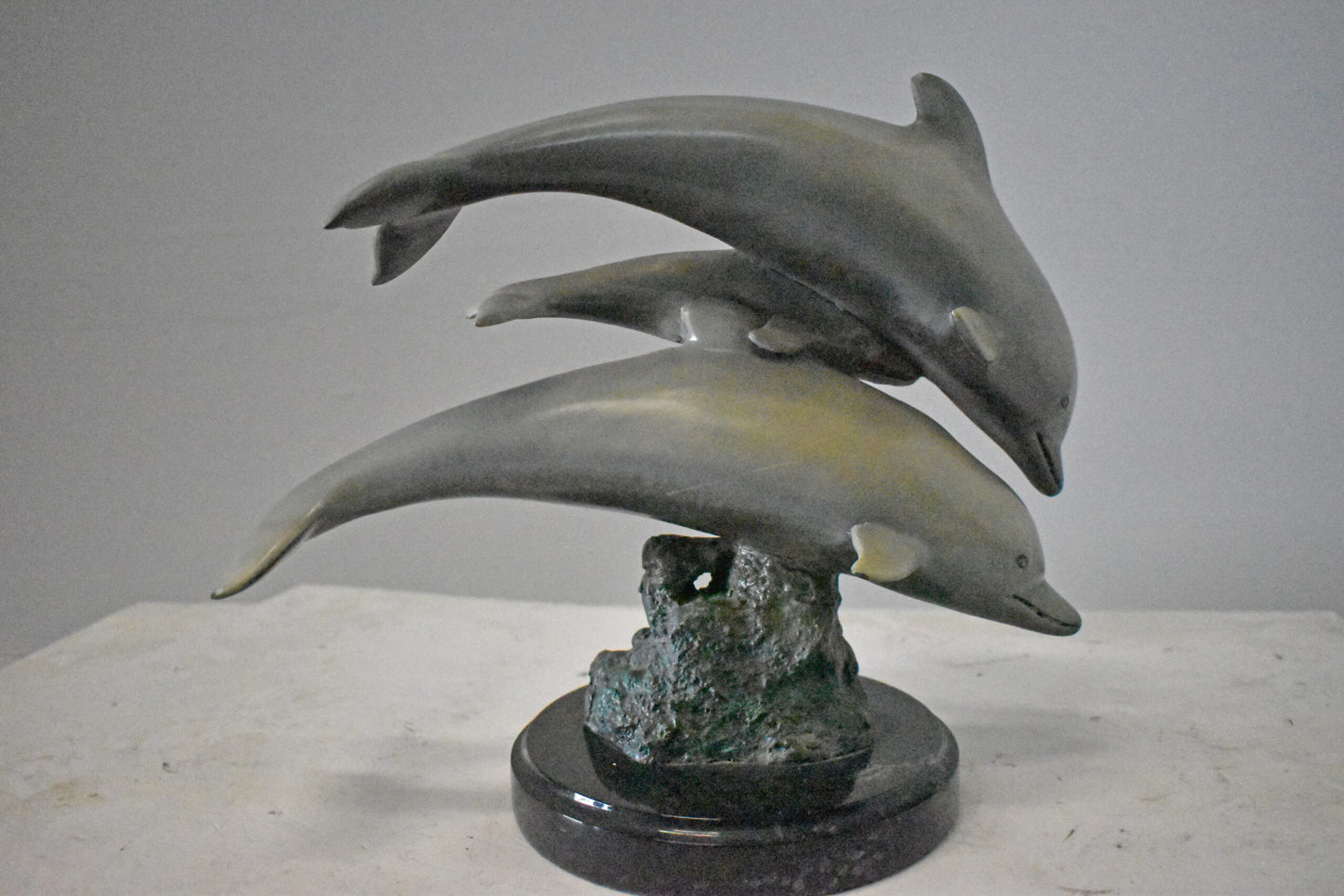 Three Grey Dolphins Swimming Bronze Statue on Marble - Size: 16"L x 9"W x 13"H.