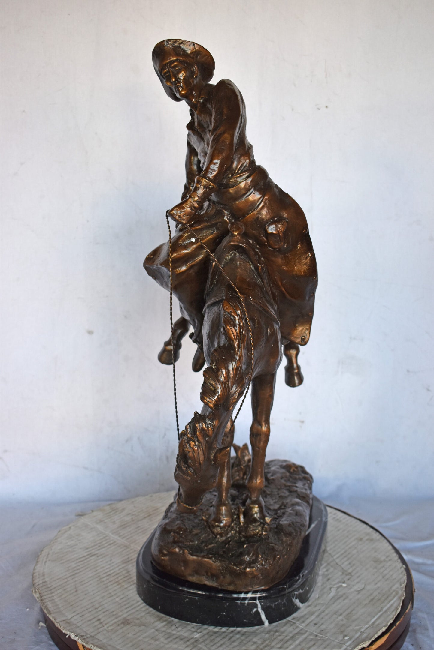 Outlaw by Remington Bronze Statue Replica - Size: 18"L x 10"W x 32"H.
