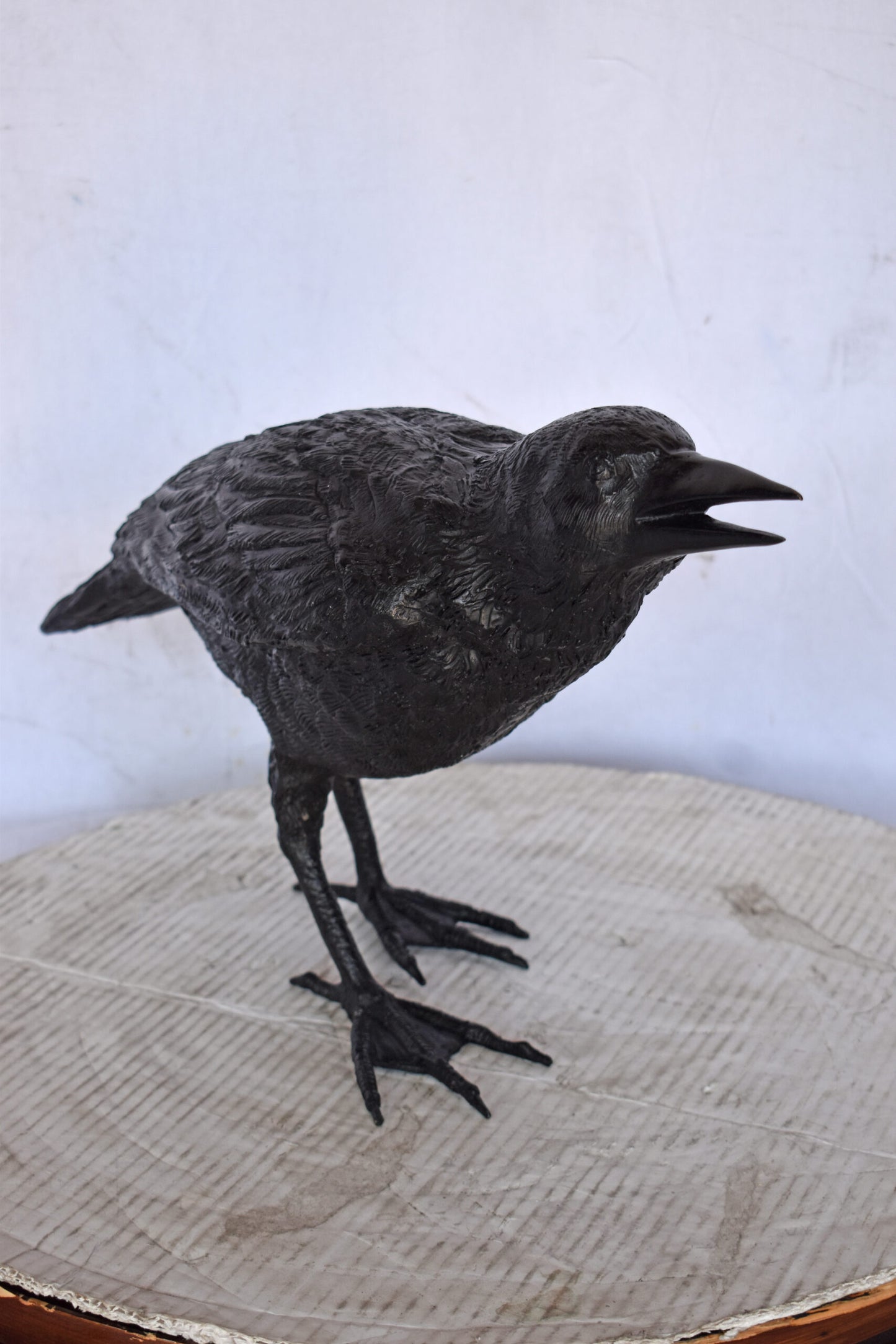 Raven Watching Forward Bronze State - Size: 22"L x 5"W x 7"H.