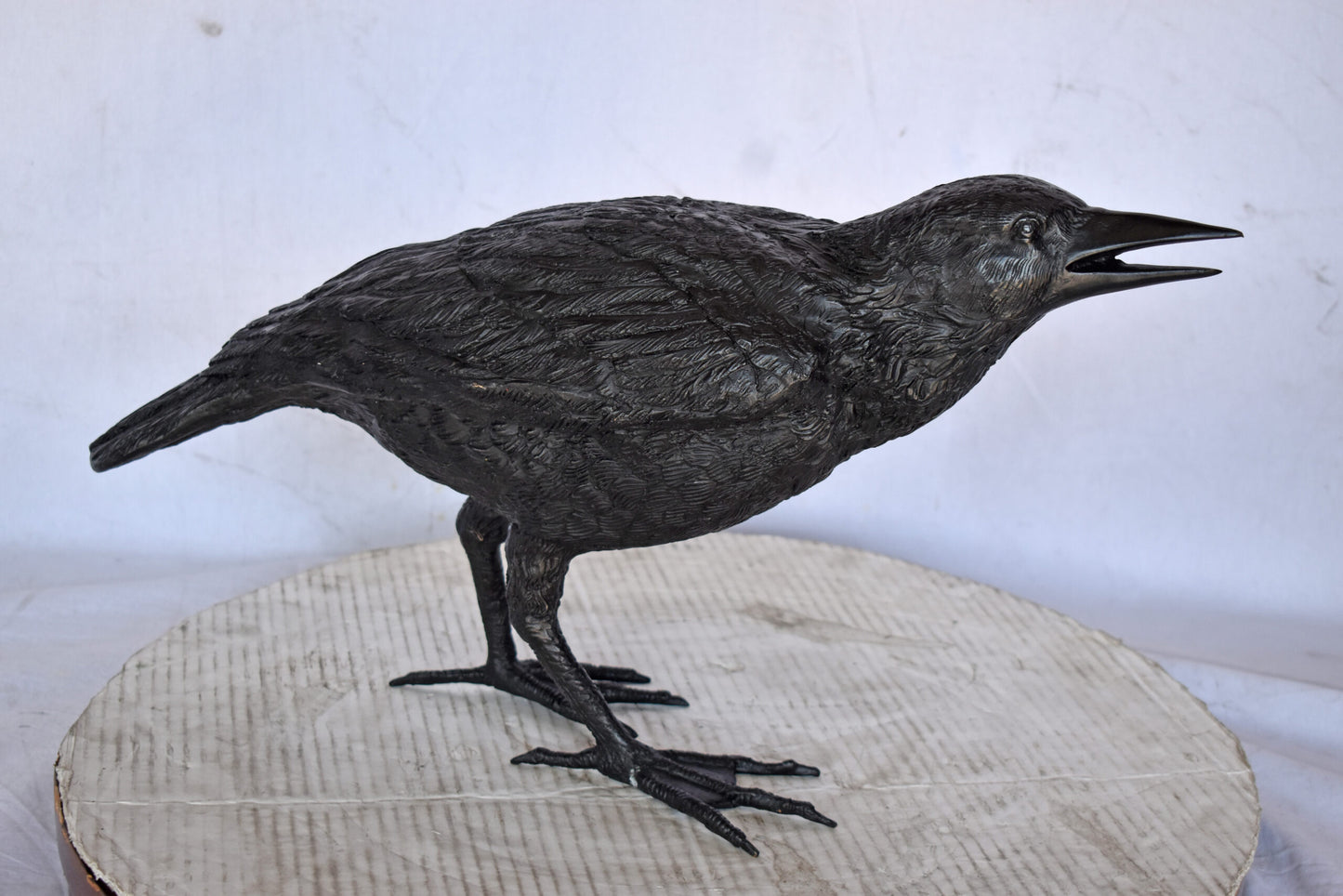 Raven Watching Forward Bronze State - Size: 22"L x 5"W x 7"H.