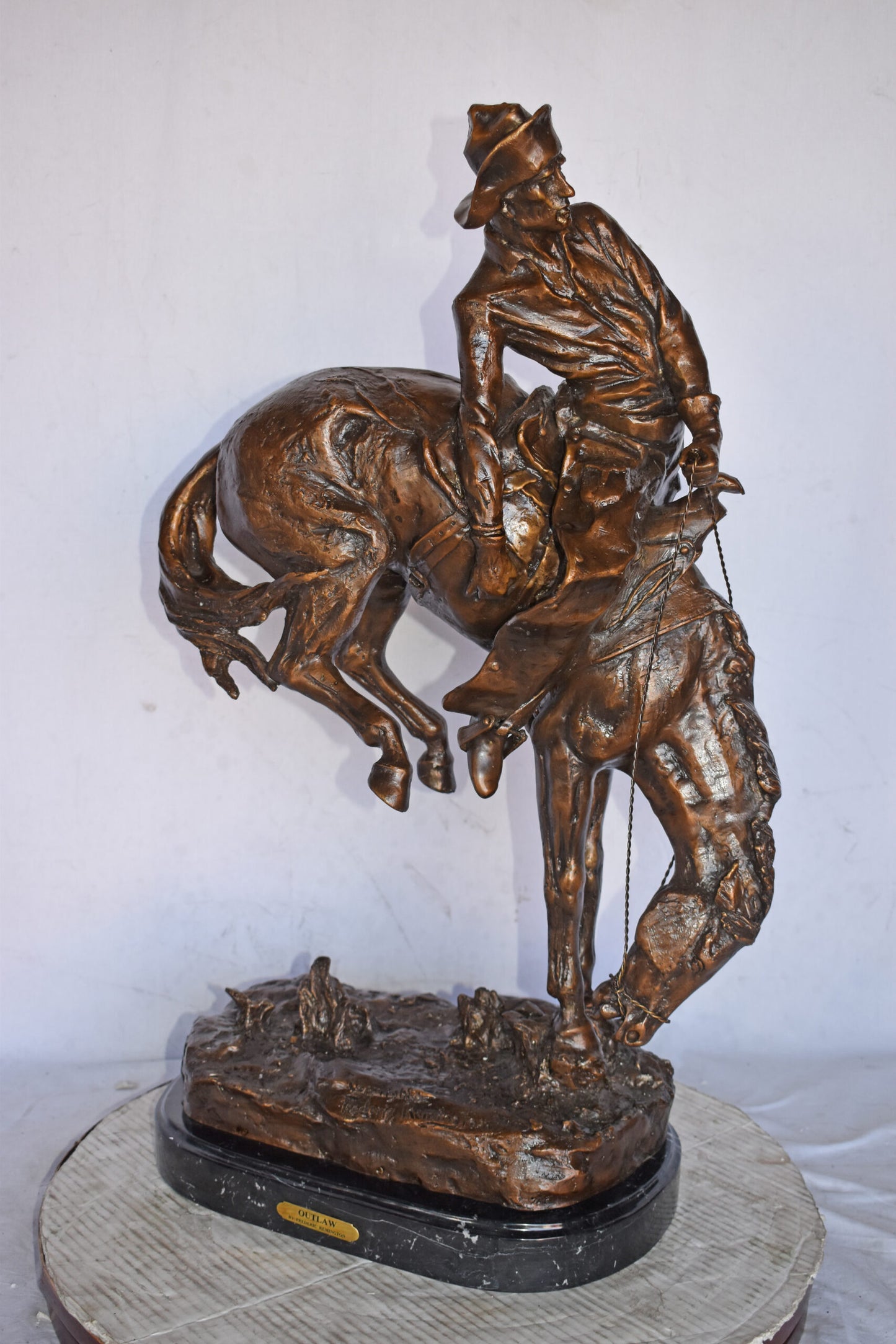 Outlaw by Remington Bronze Statue Replica - Size: 18"L x 10"W x 32"H.