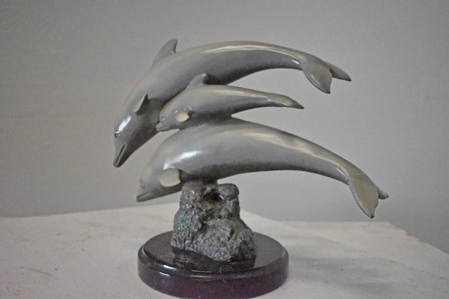 Three Grey Dolphins Swimming Bronze Statue on Marble - Size: 16"L x 9"W x 13"H.