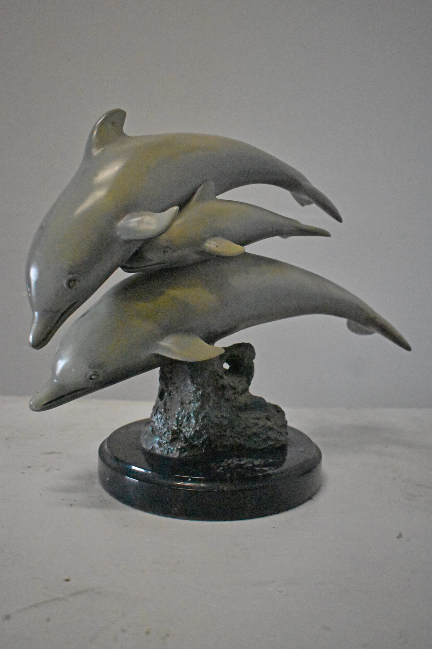 Three Grey Dolphins Swimming Bronze Statue on Marble - Size: 16"L x 9"W x 13"H.