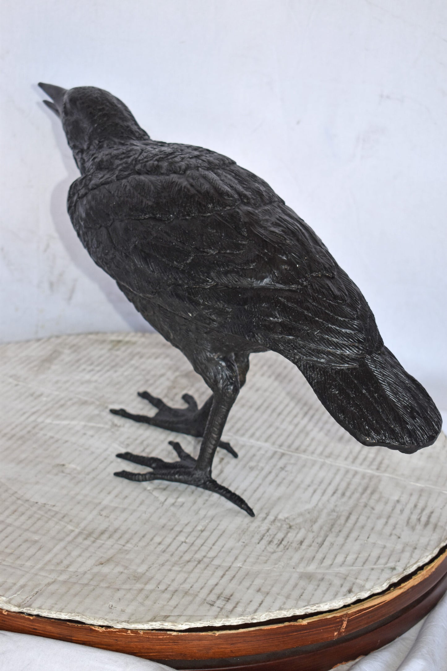 Raven Watching Forward Bronze State - Size: 22"L x 5"W x 7"H.
