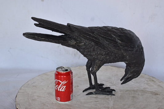 Raven Looking Down Bronze State - Size: 19"L x 5"W x 11"H.