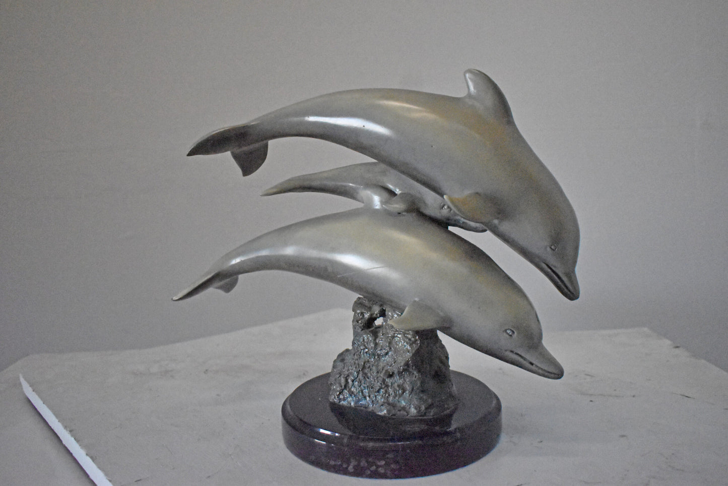 Three Grey Dolphins Swimming Bronze Statue on Marble - Size: 16"L x 9"W x 13"H.