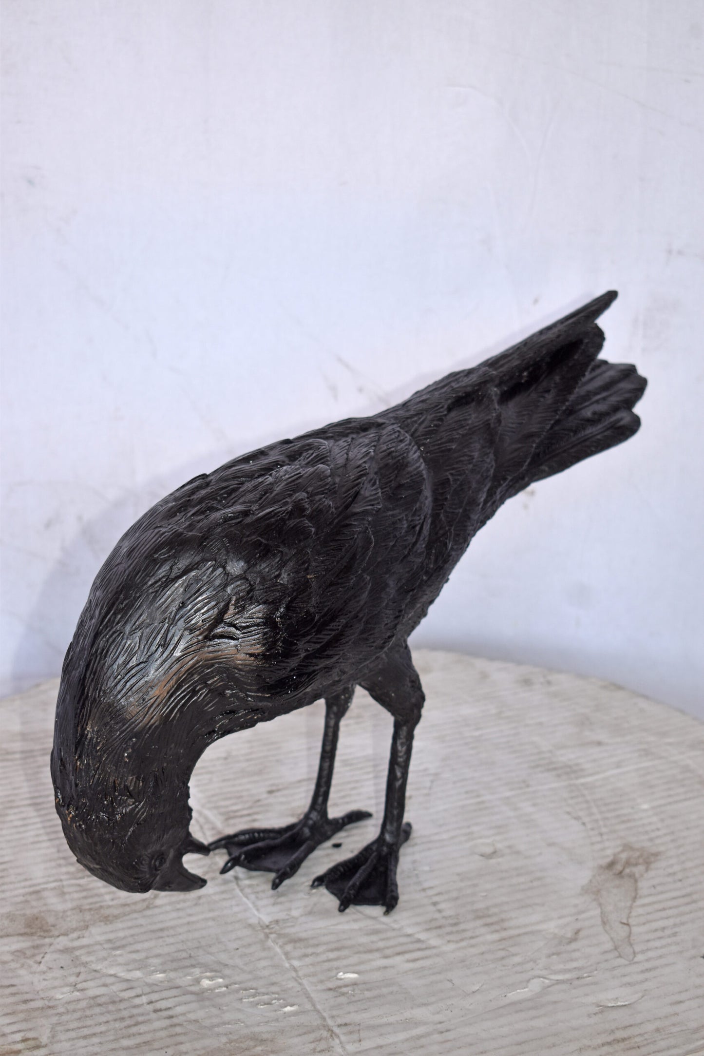Raven Looking Down Bronze State - Size: 19"L x 5"W x 11"H.