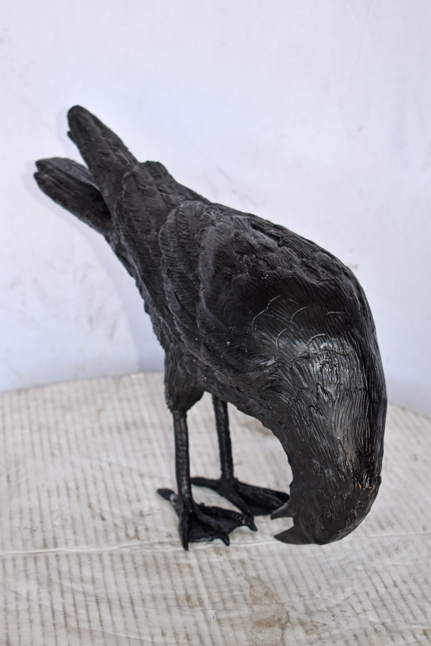 Raven Looking Down Bronze State - Size: 19"L x 5"W x 11"H.