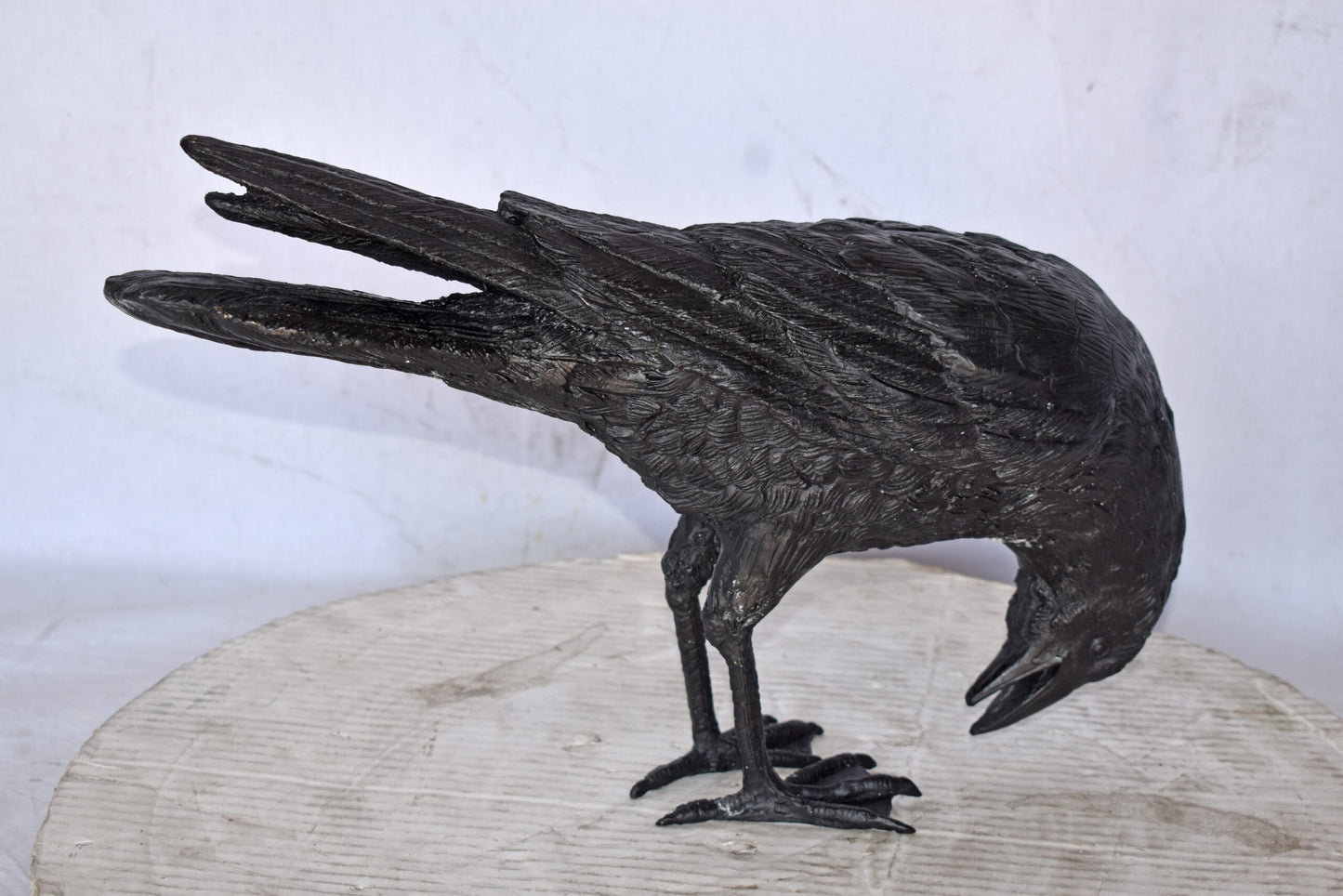 Raven Looking Down Bronze State - Size: 19"L x 5"W x 11"H.