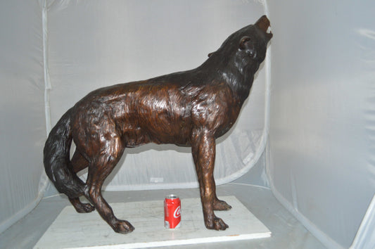 Howling Wolf Bronze Statue -  Size: 40"L x 10"W x 32"H.