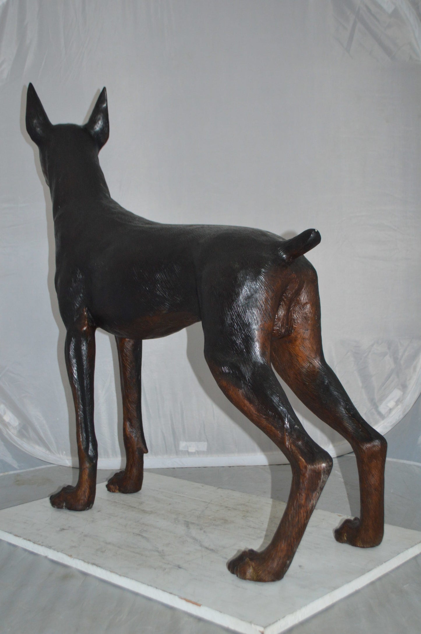 Doberman Dog Bronze Statue -  Size: 36"L x 9"W x 38"H.