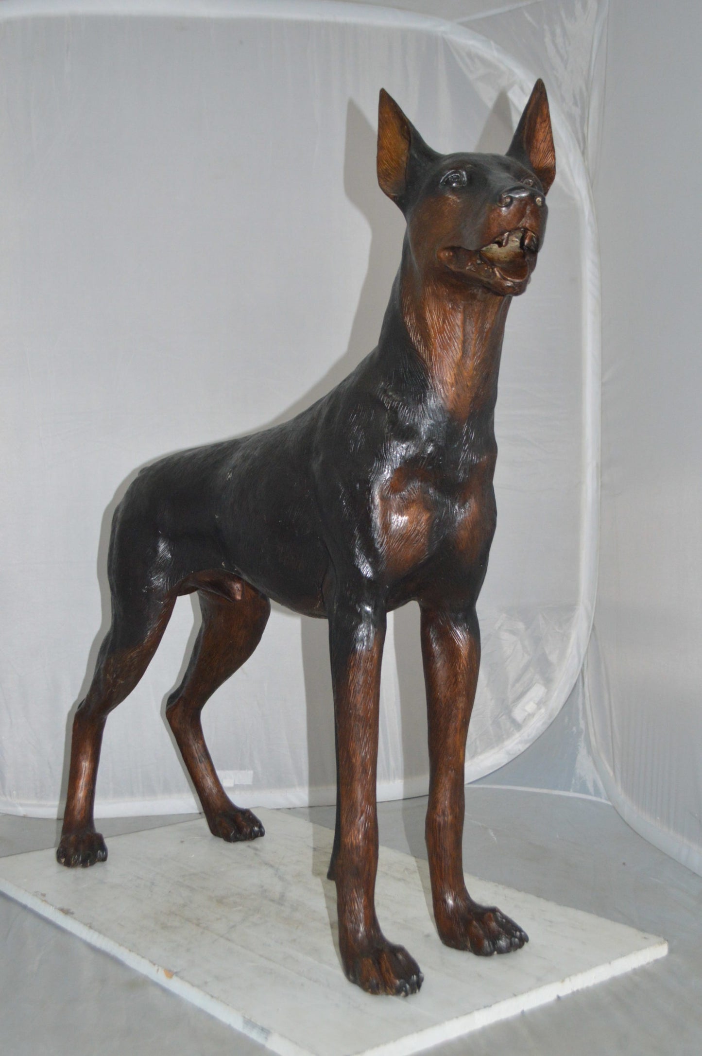 Doberman Dog Bronze Statue -  Size: 36"L x 9"W x 38"H.