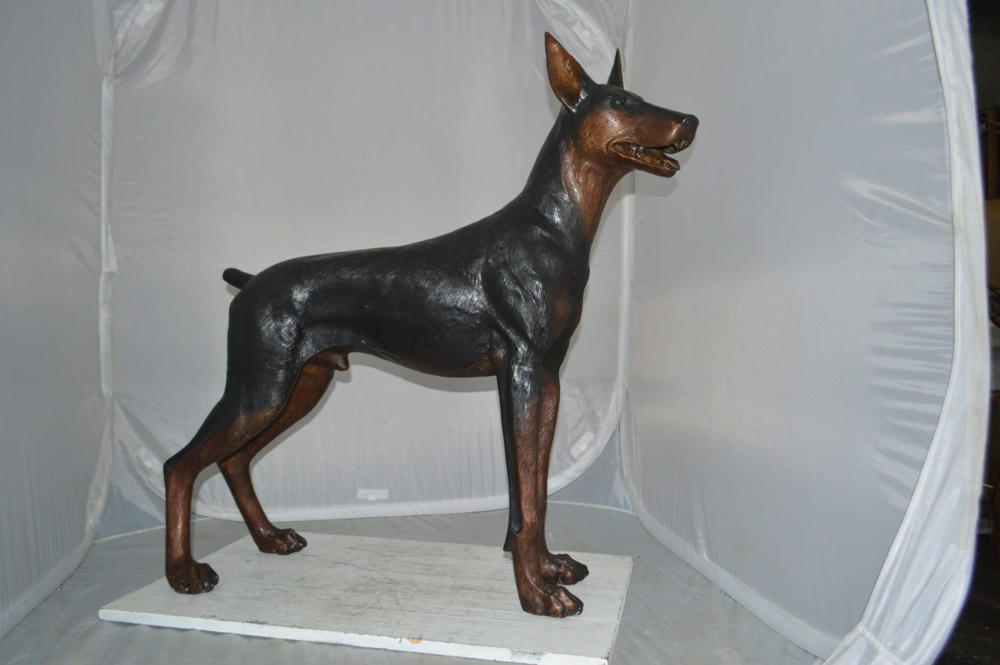 Doberman Dog Bronze Statue -  Size: 36"L x 9"W x 38"H.