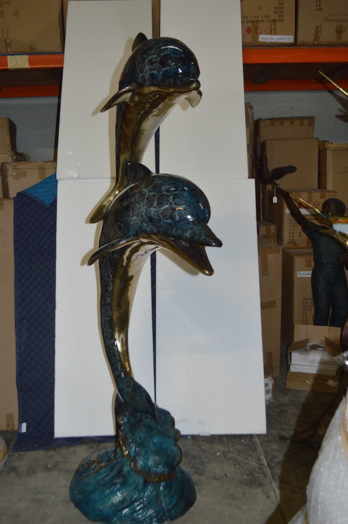 Two Dolphins Overreach Others on Waves Bronze Statue - 44"L x 23"W x 76"H.