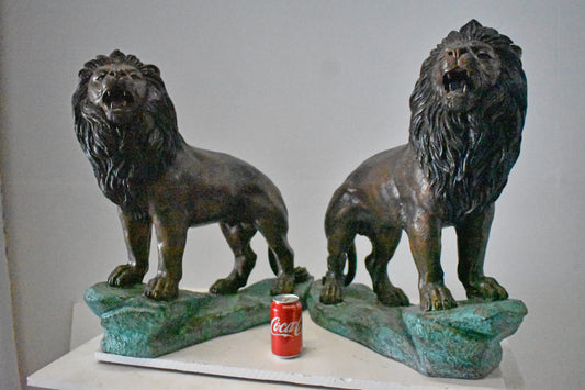 Pair of Standing Lions Bronze Statues - Size: 26"L x 11"W x 25"H.