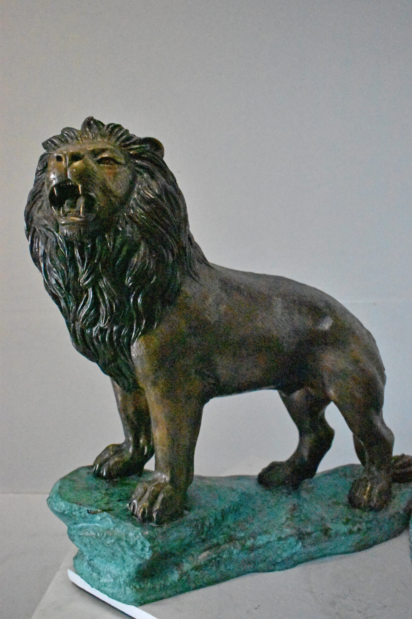 Pair of Standing Lions Bronze Statues - Size: 26"L x 11"W x 25"H.