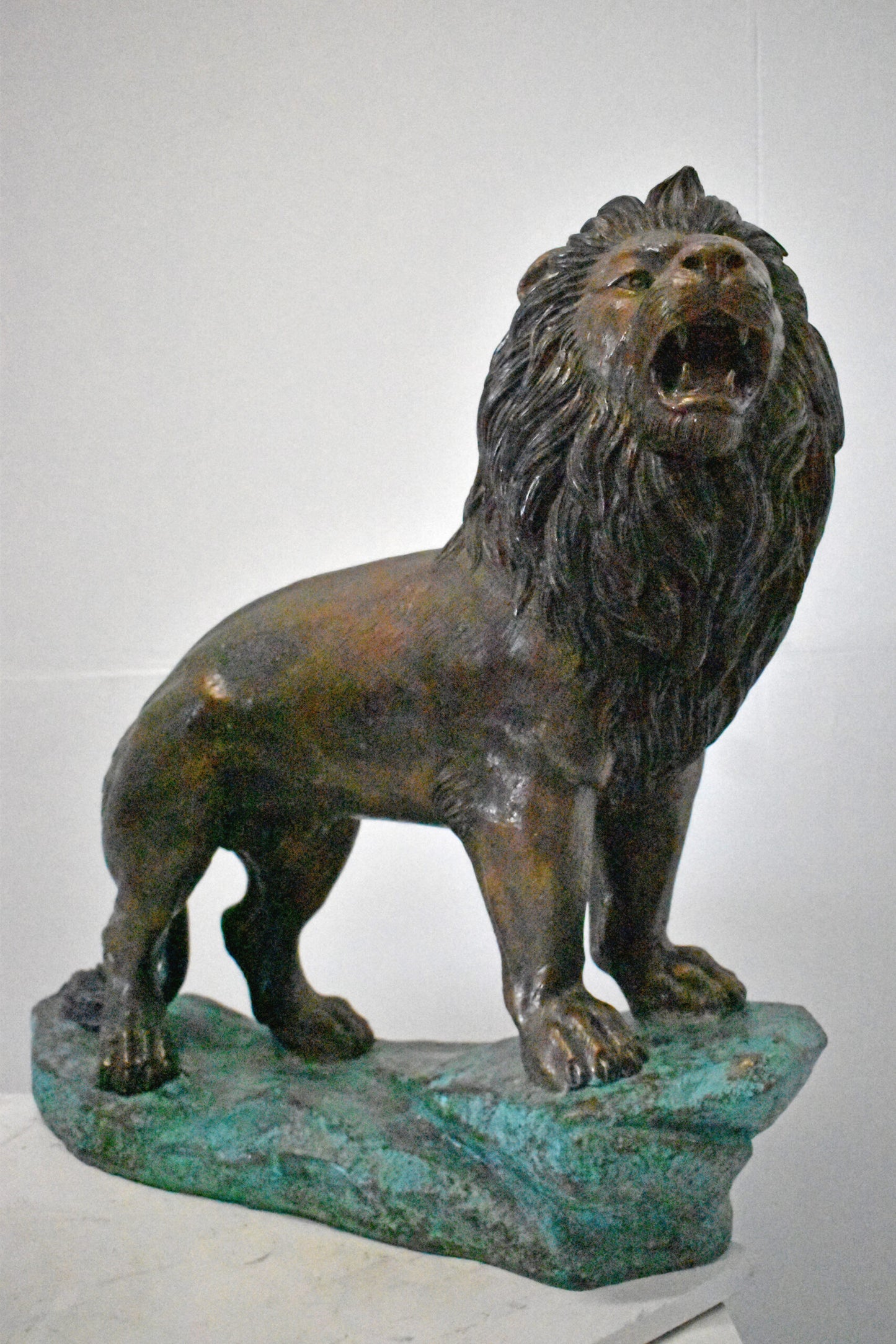 Pair of Standing Lions Bronze Statues - Size: 26"L x 11"W x 25"H.