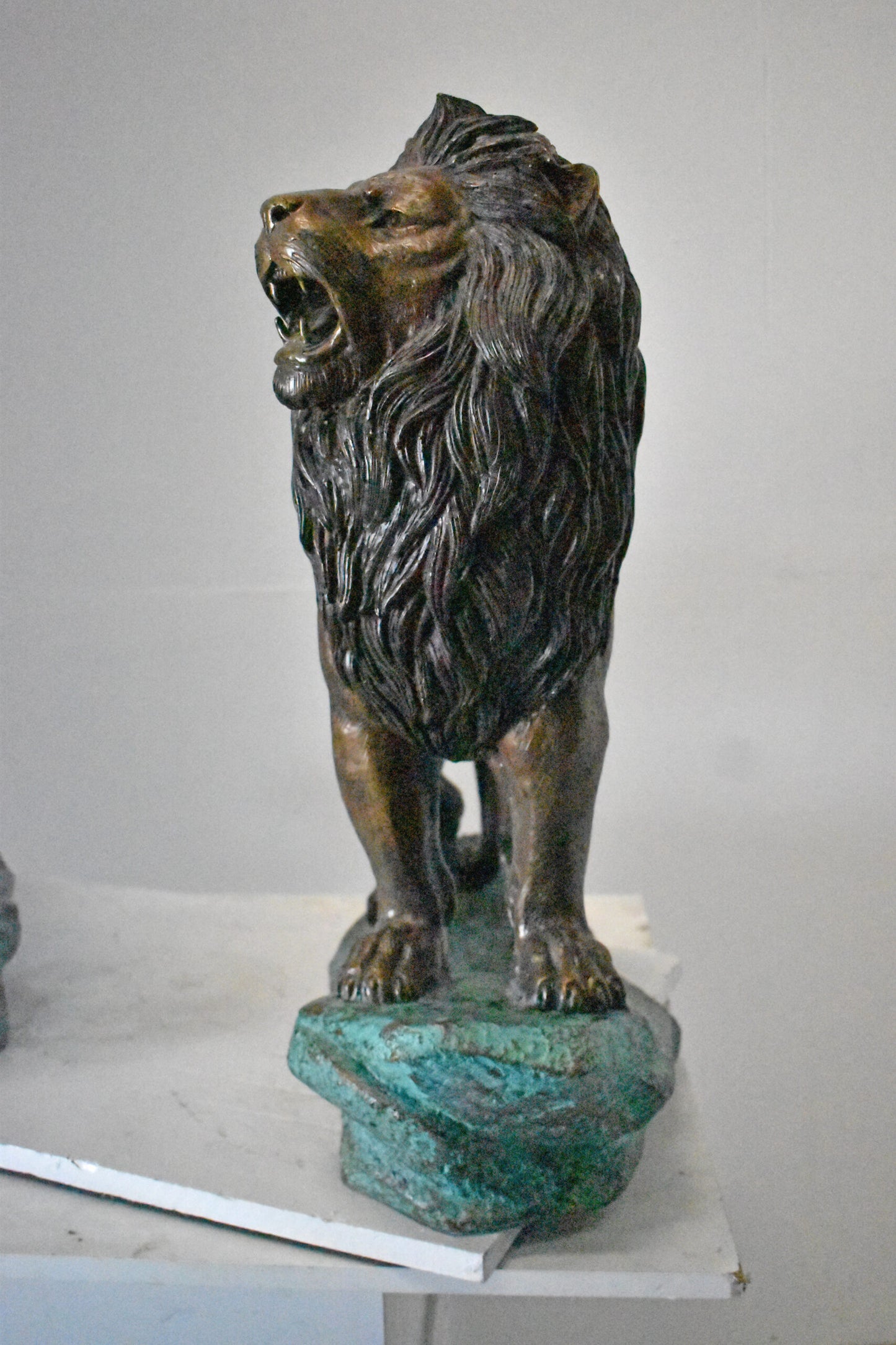 Pair of Standing Lions Bronze Statues - Size: 26"L x 11"W x 25"H.