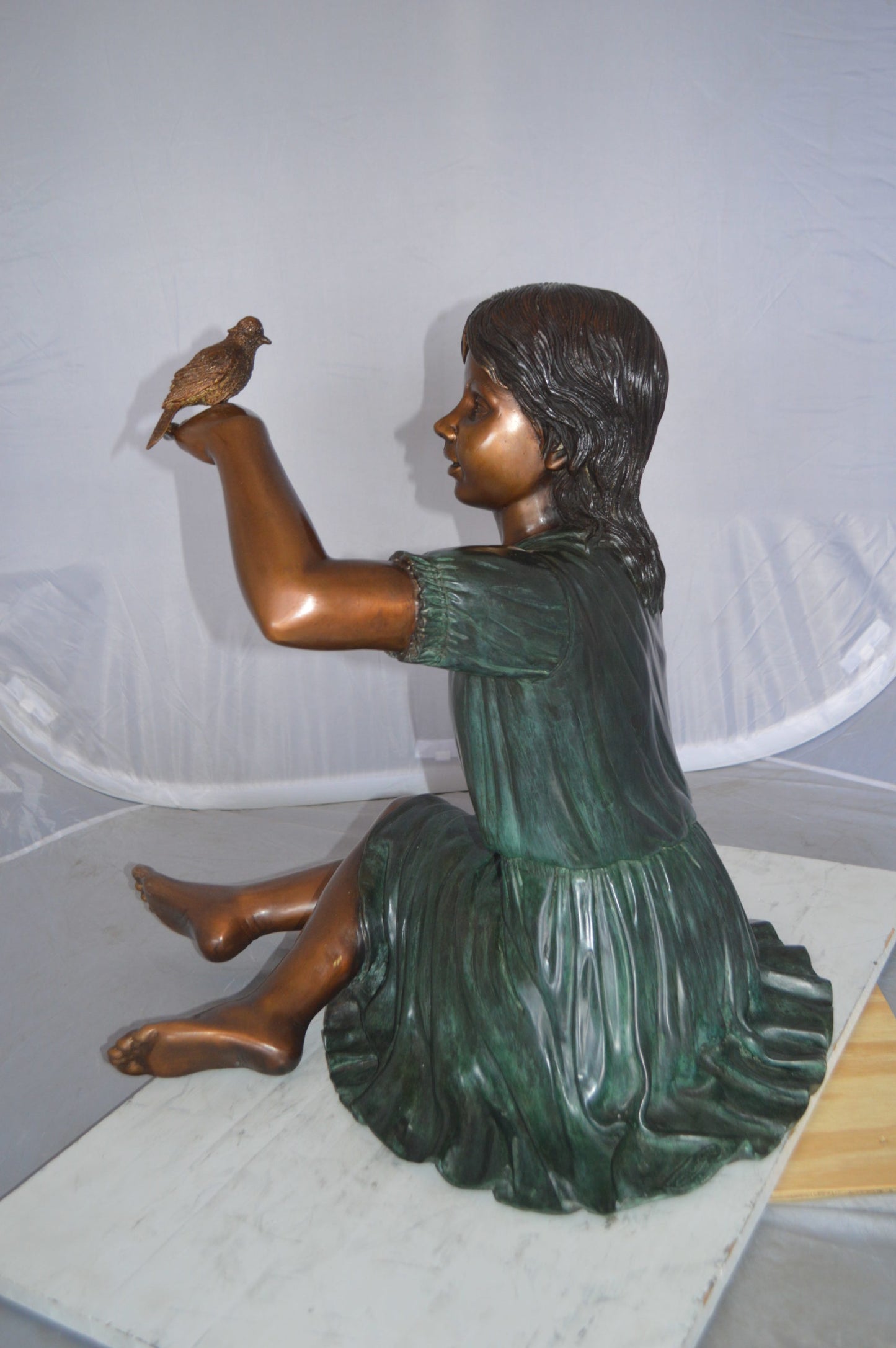 Girl with a Sparrow Bronze Statue - Size: 24"L x 30"W x 25"H.