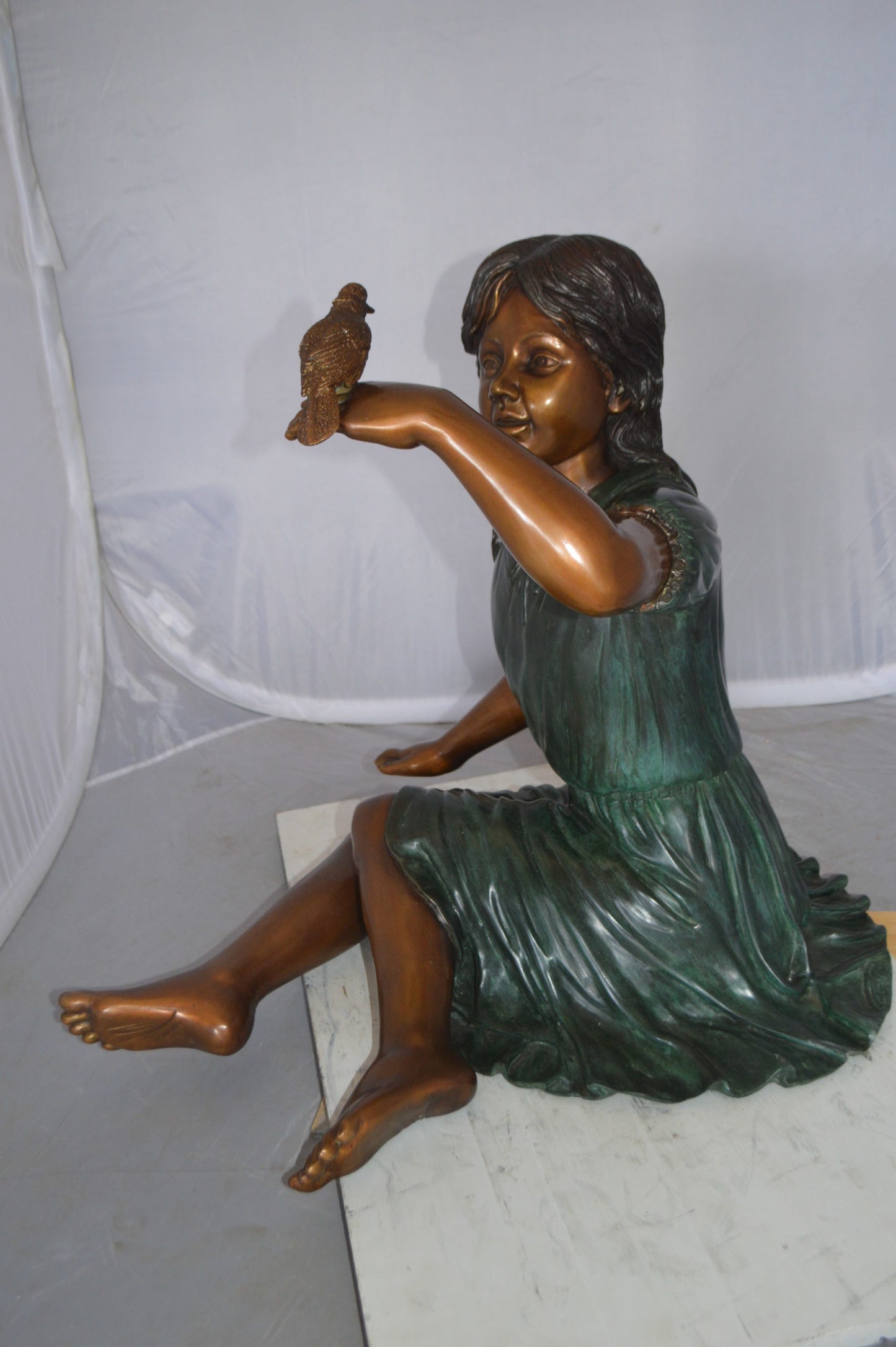 Girl with a Sparrow Bronze Statue - Size: 24"L x 30"W x 25"H.
