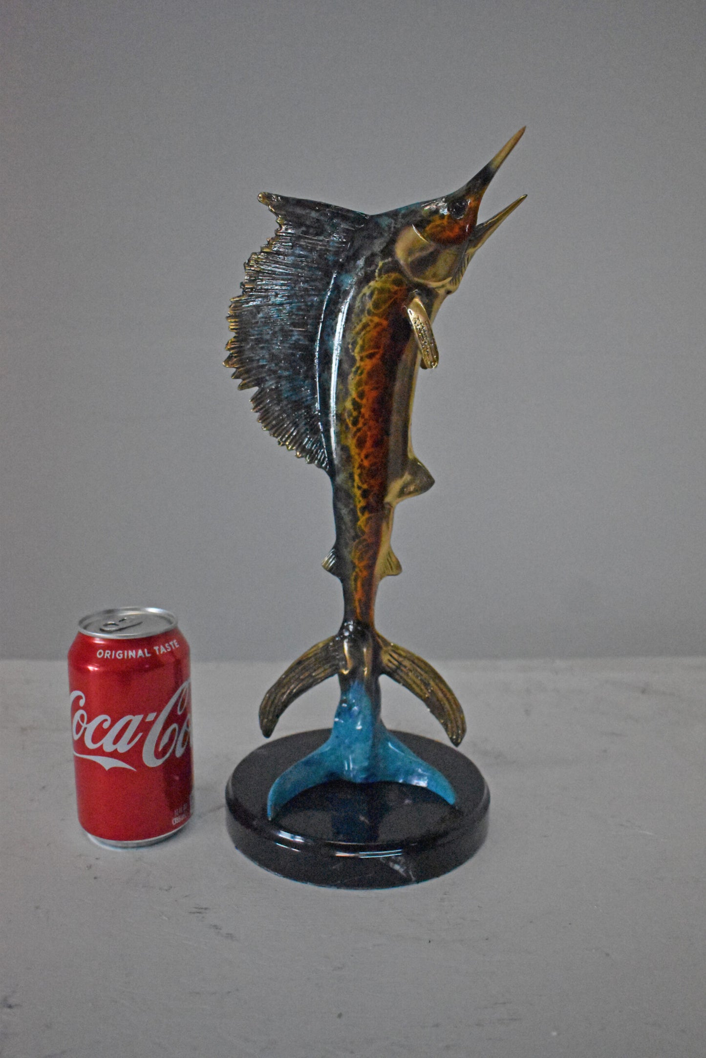 Single Sailfish Bronze Statue Mounted on Round Marble - Size: 6"L x 6"W x 15"H.
