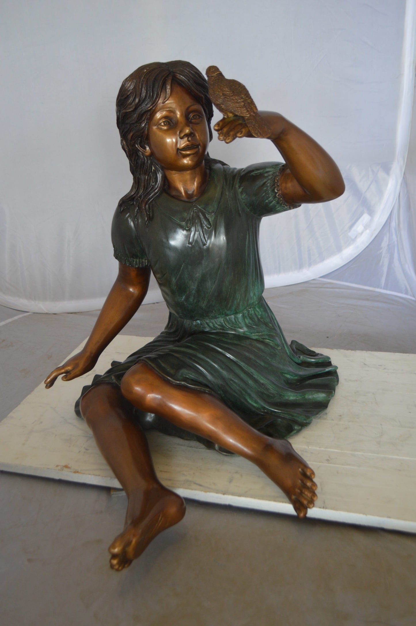 Girl with a Sparrow Bronze Statue - Size: 24"L x 30"W x 25"H.