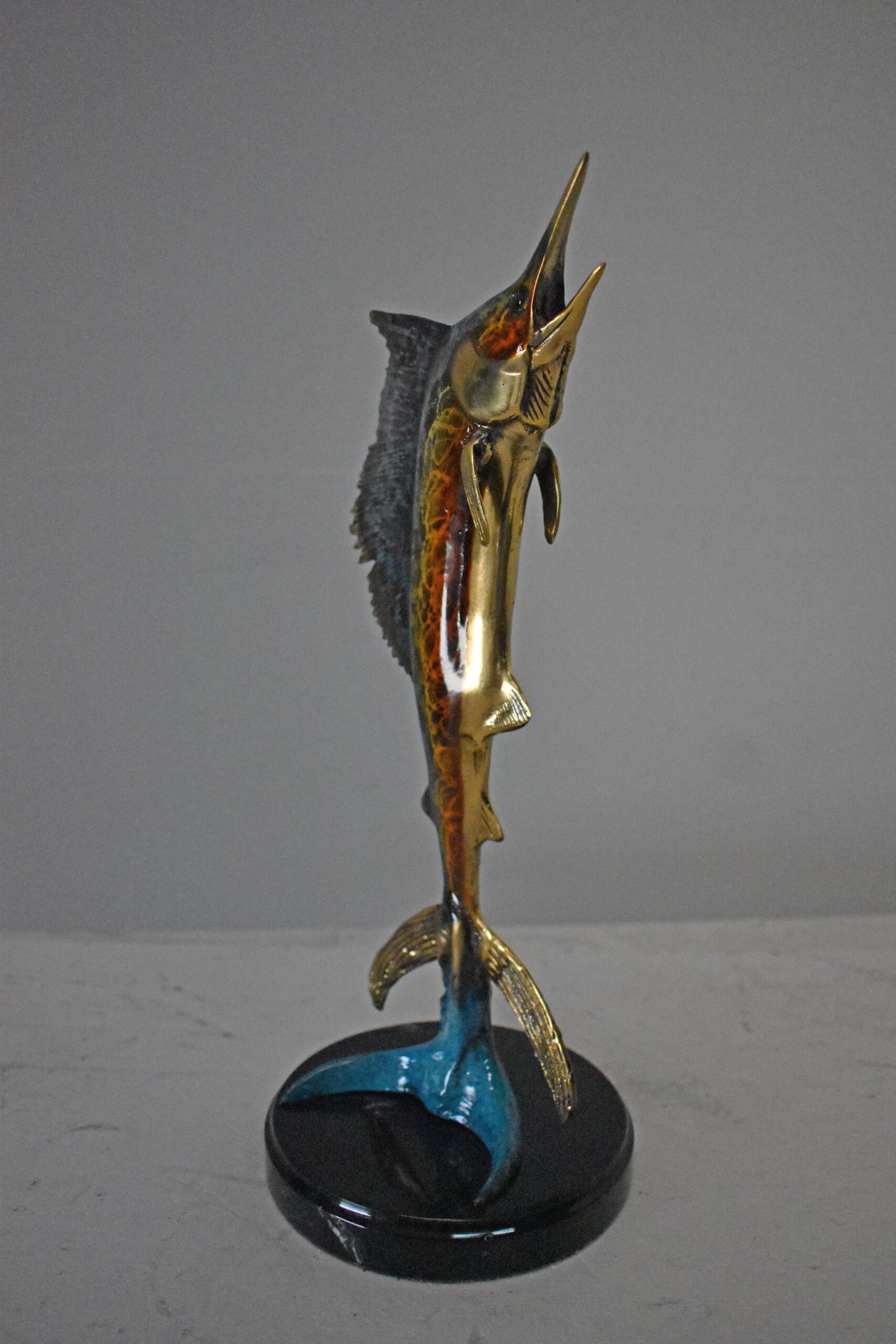 Single Sailfish Bronze Statue Mounted on Round Marble - Size: 6"L x 6"W x 15"H.