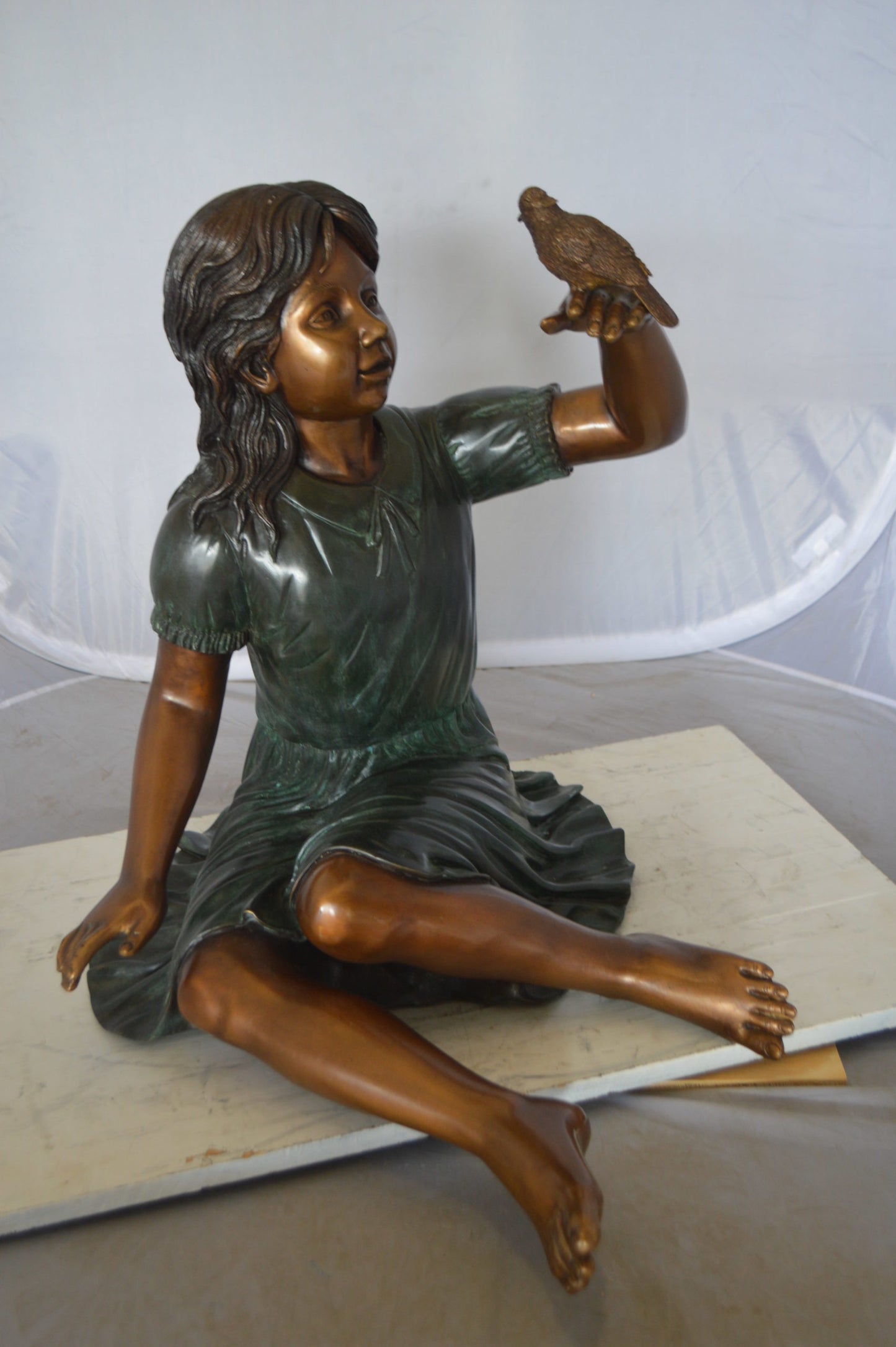 Girl with a Sparrow Bronze Statue - Size: 24"L x 30"W x 25"H.