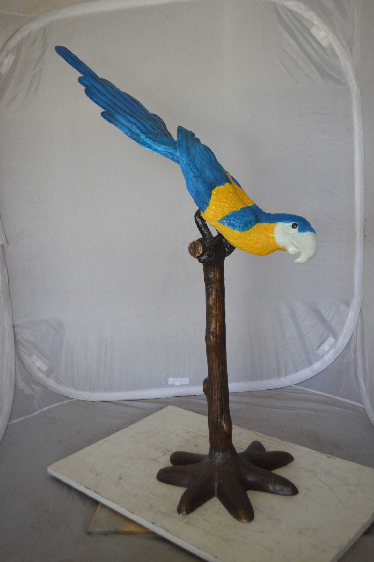 Parrot on Tree - Head Down Bronze Statue - Size: 39"L x 15"W x 47"H.