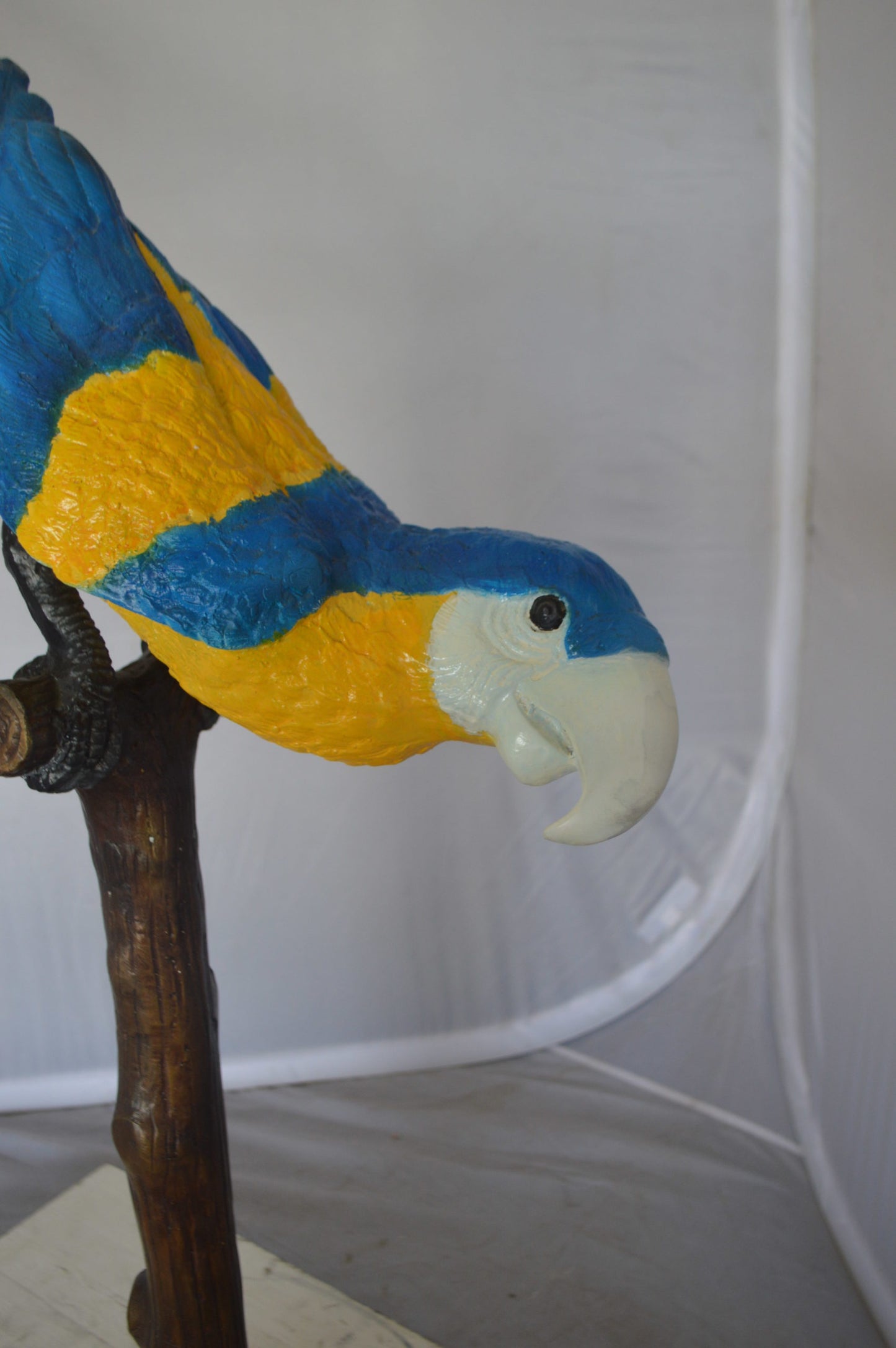 Parrot on Tree - Head Down Bronze Statue - Size: 39"L x 15"W x 47"H.