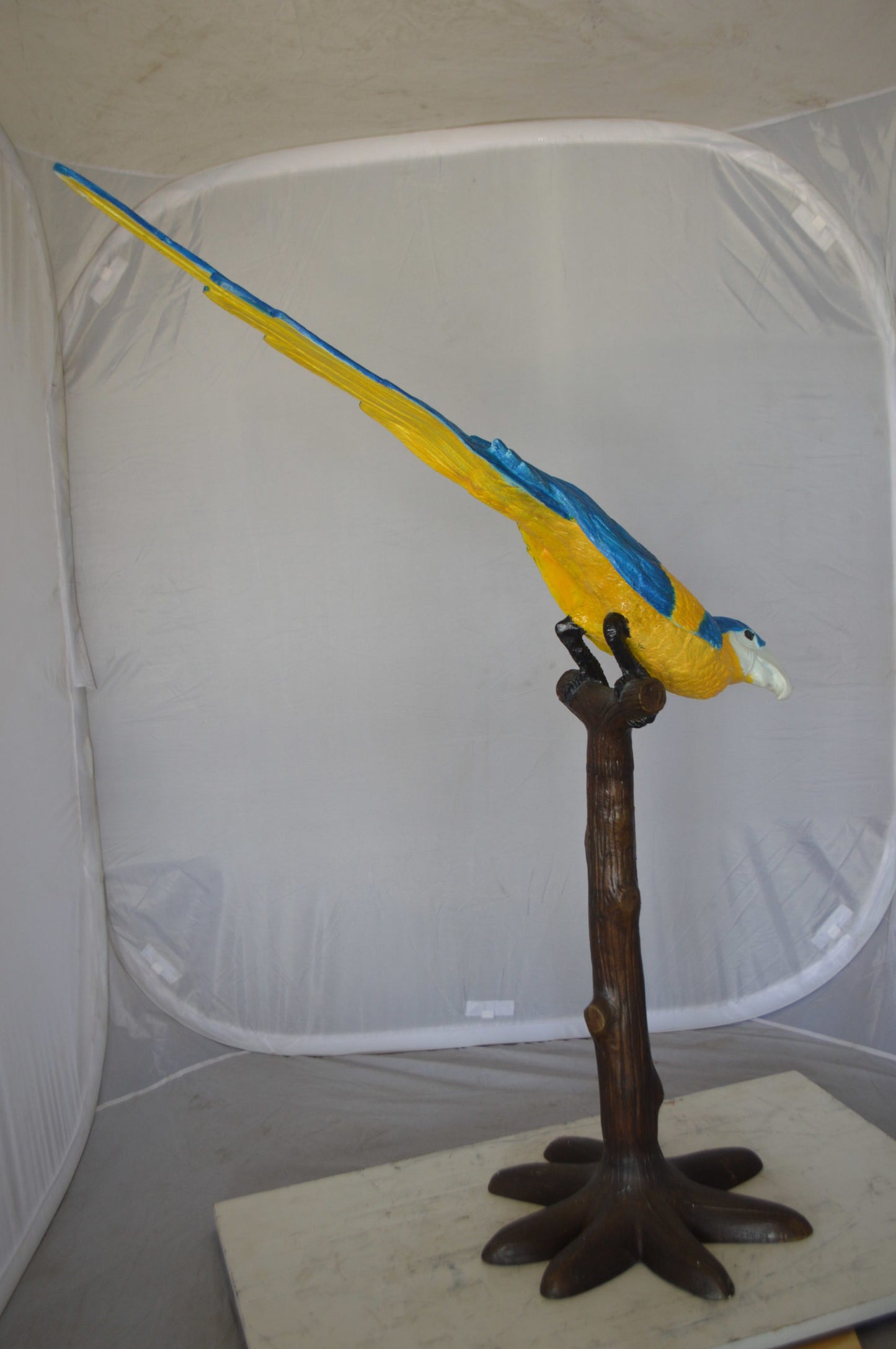 Parrot on Tree - Head Down Bronze Statue - Size: 39"L x 15"W x 47"H.
