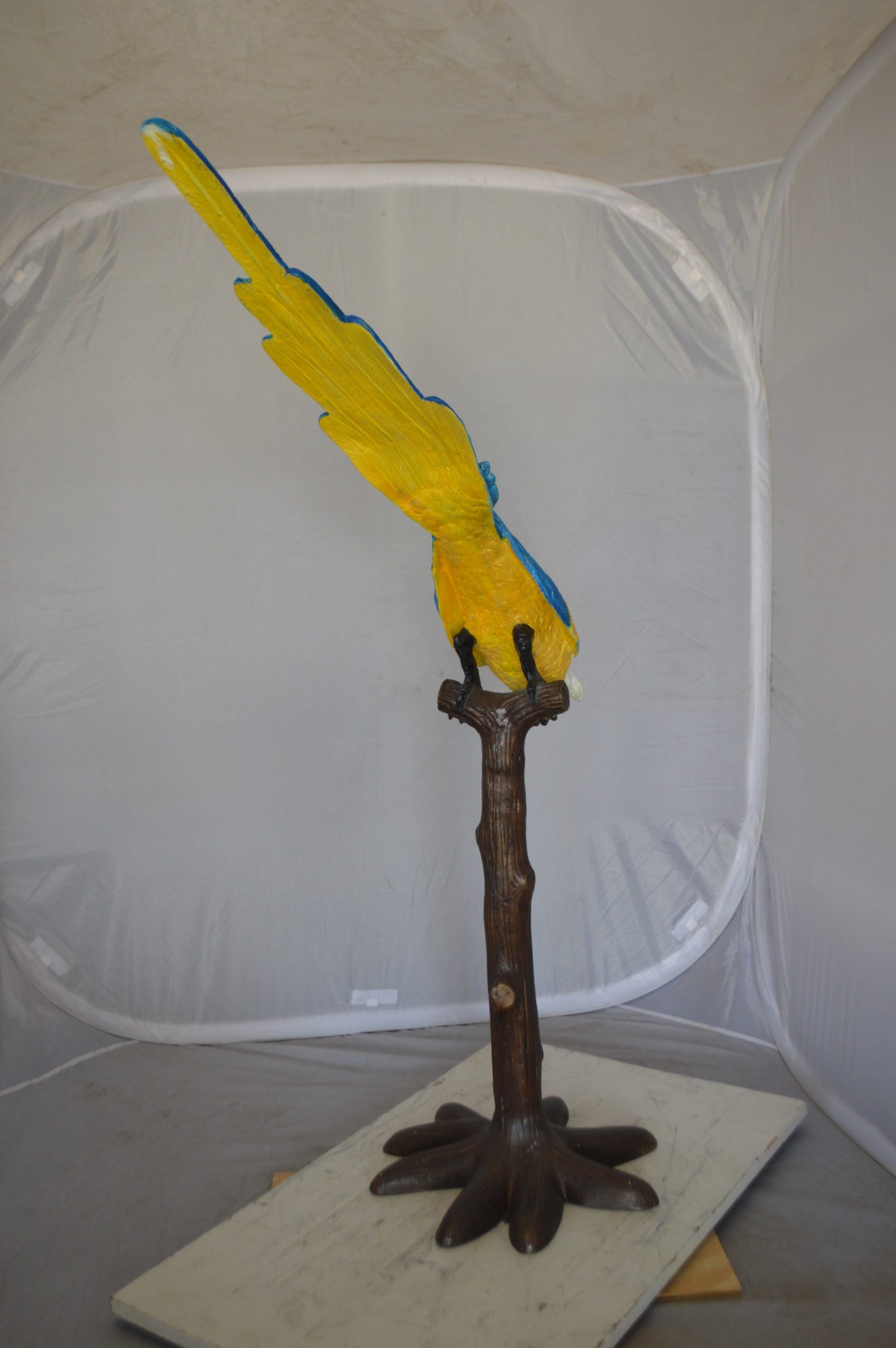 Parrot on Tree - Head Down Bronze Statue - Size: 39"L x 15"W x 47"H.