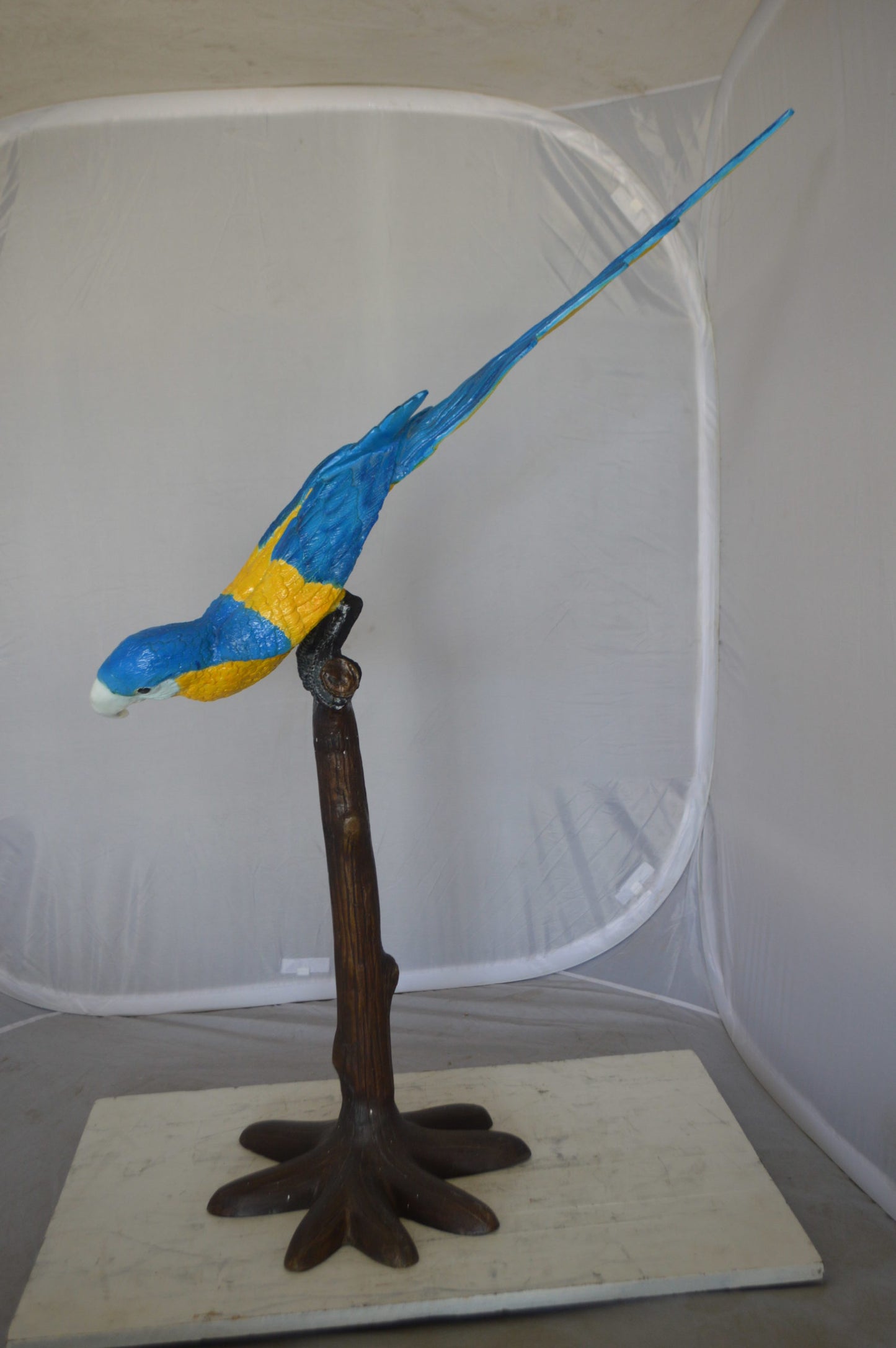 Parrot on Tree - Head Down Bronze Statue - Size: 39"L x 15"W x 47"H.