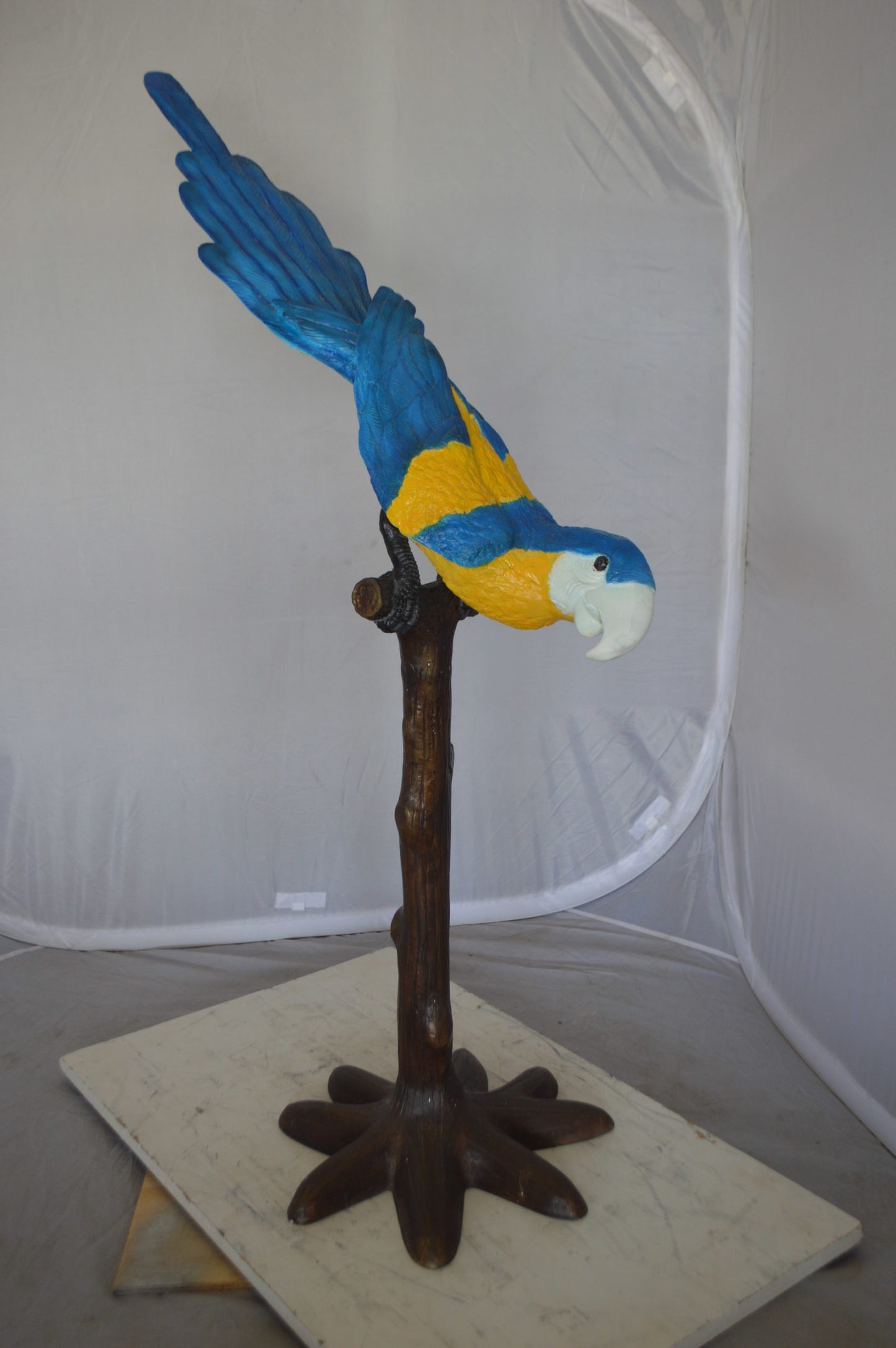 Parrot on Tree - Head Down Bronze Statue - Size: 39"L x 15"W x 47"H.