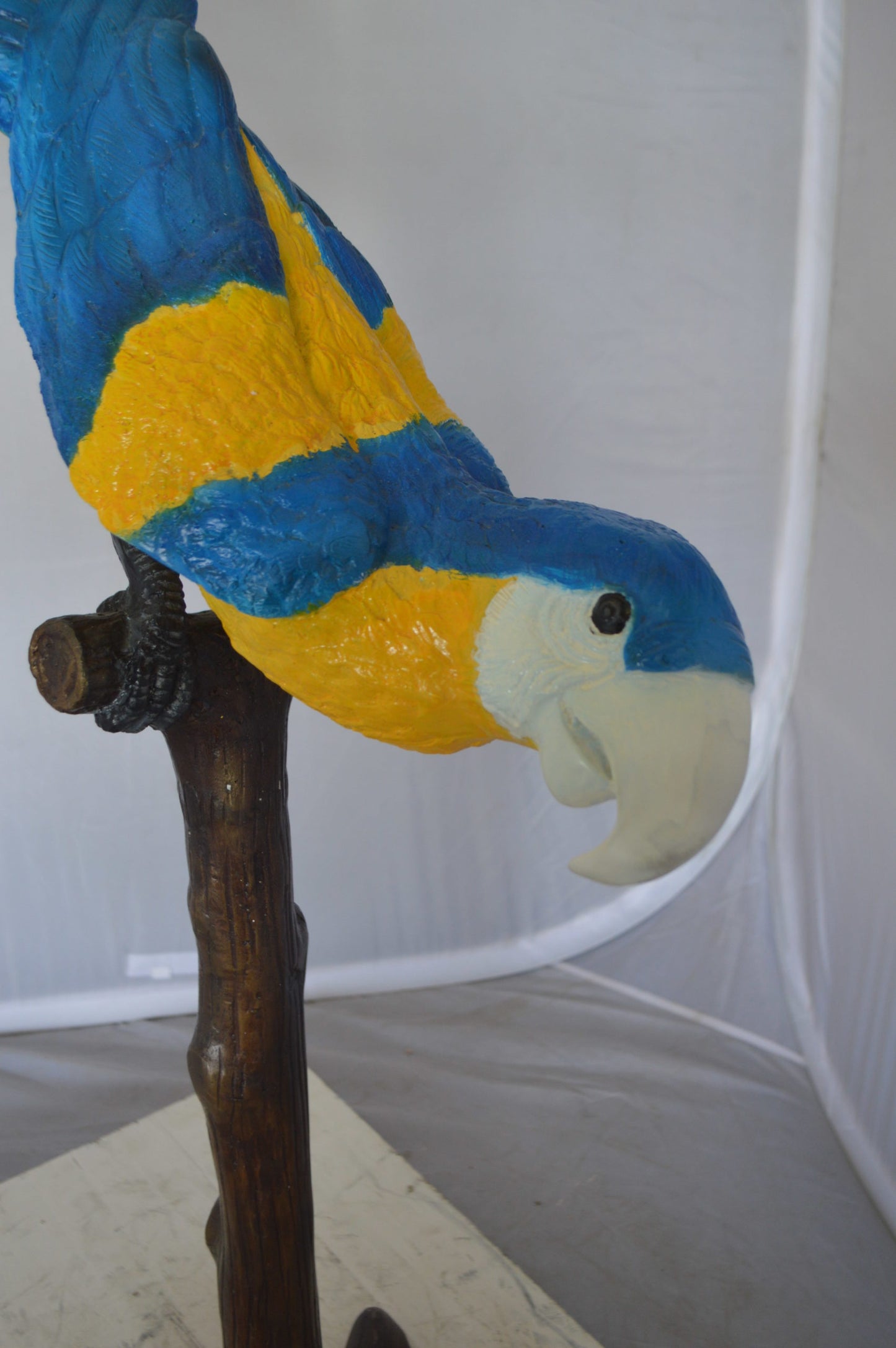 Parrot on Tree - Head Down Bronze Statue - Size: 39"L x 15"W x 47"H.