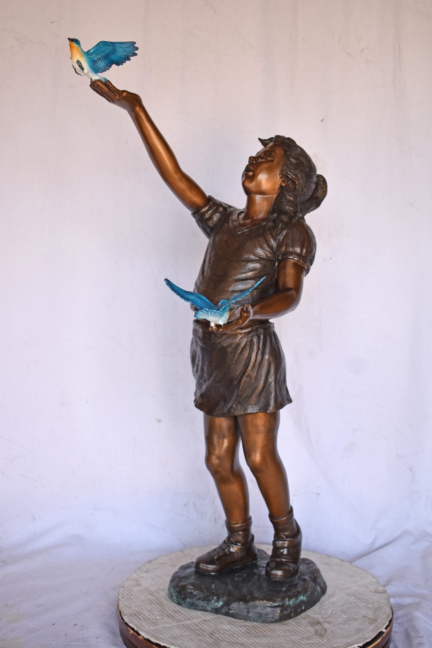 Girl, sandy, with two Blue birds Bronze Statue - Size: 25"L x 23"W x 41"H.