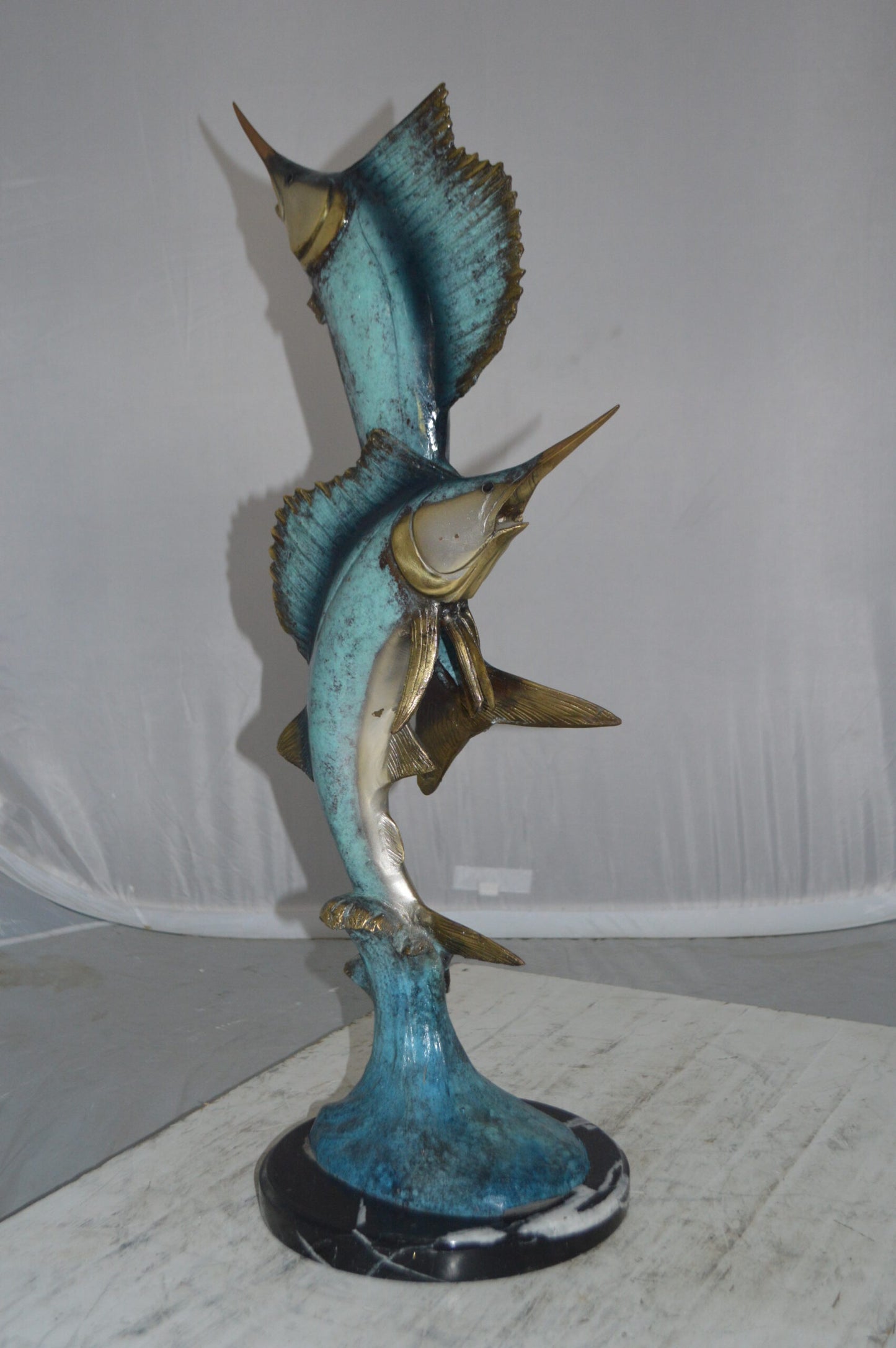 Two Sailfish jumping of water bronze statue - Size: 13"L x 6"W x 28"H.