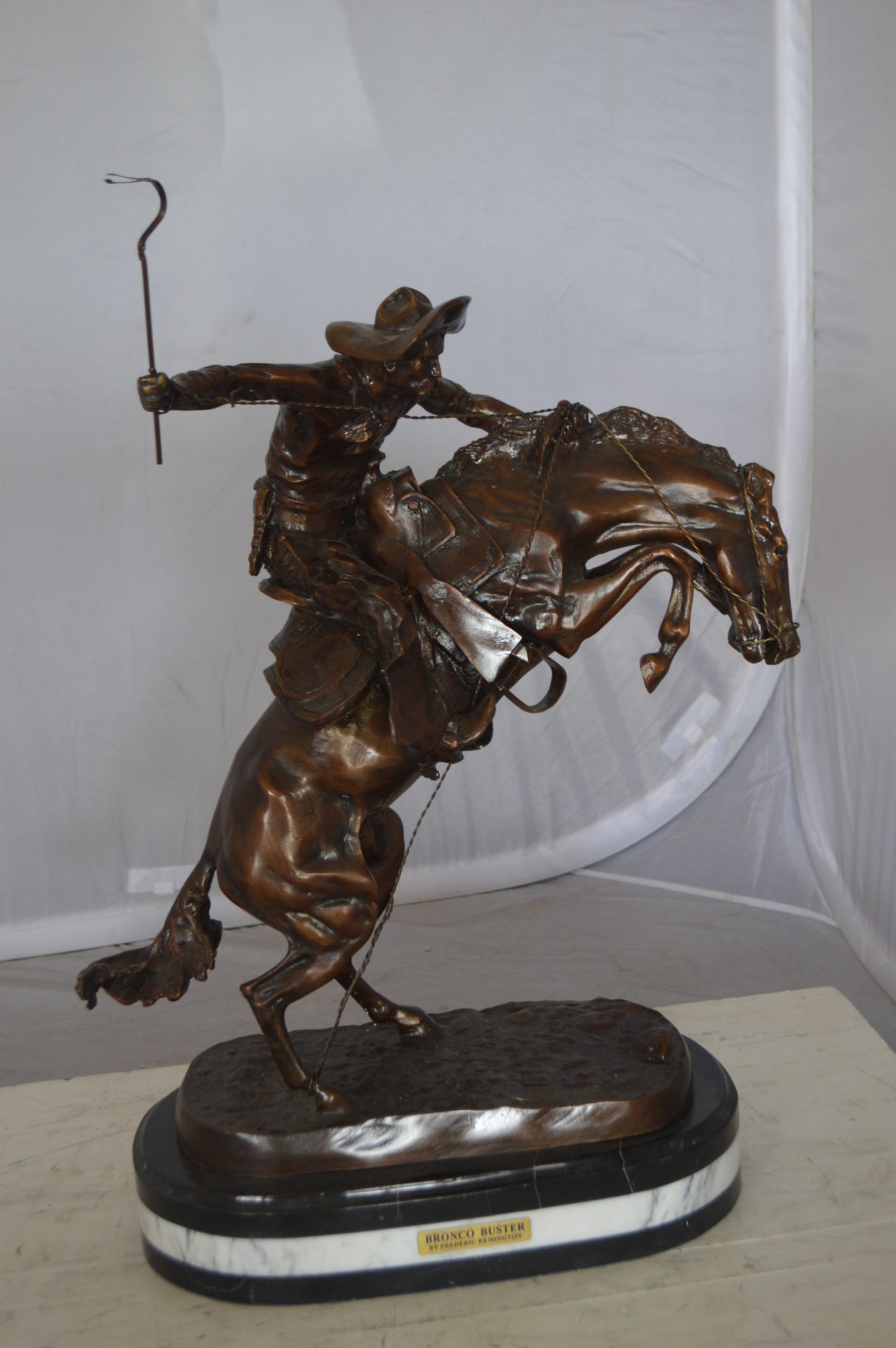 Bronco Buster by Remington Bronze Statue on a triple marble - 21"x 10"x 26"H.
