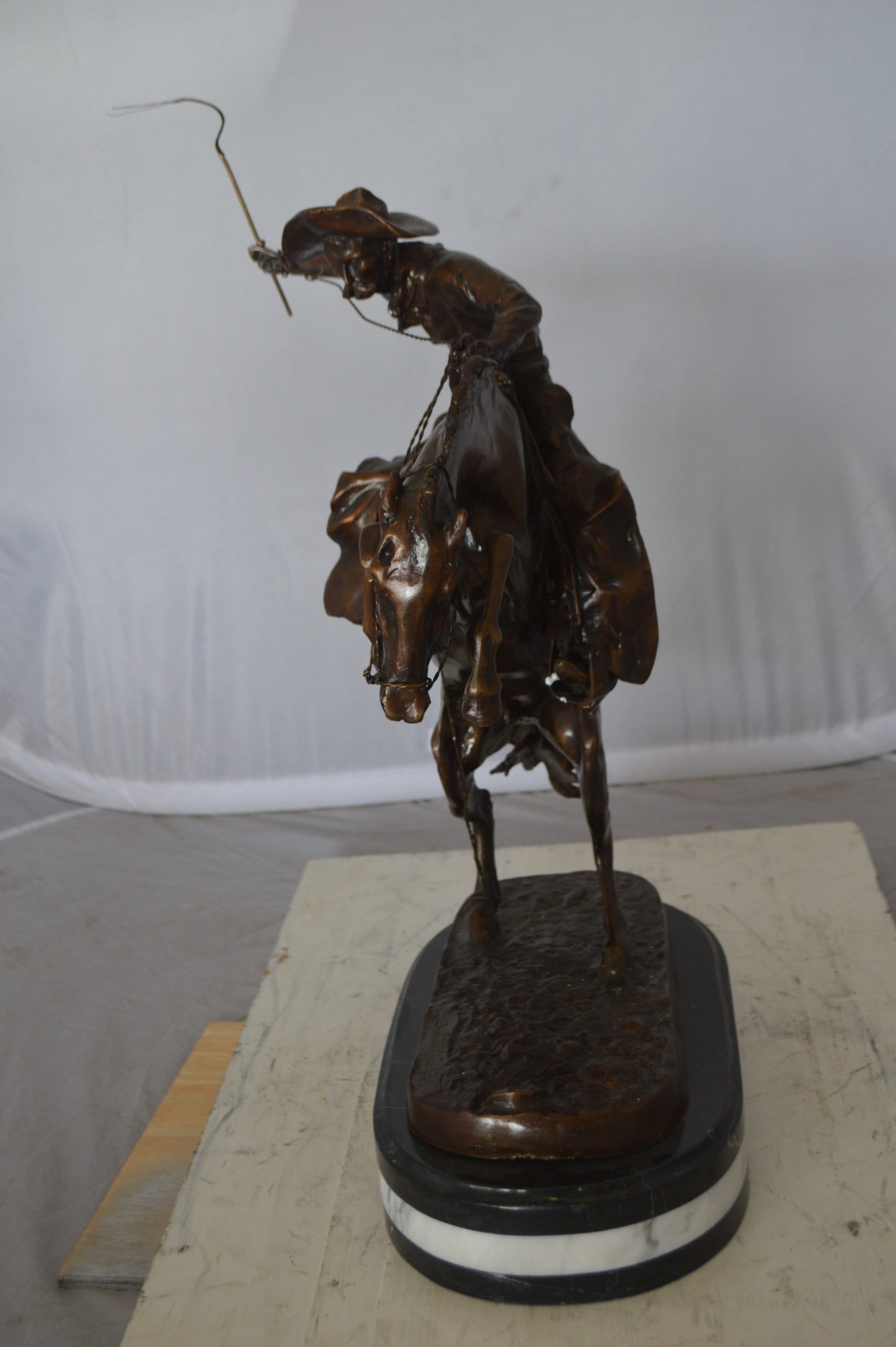 Bronco Buster by Remington Bronze Statue on a triple marble - 21"x 10"x 26"H.