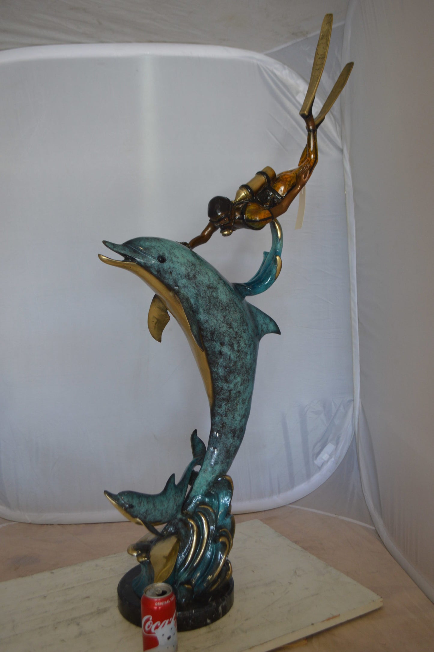 Diver With Dolphin Bronze Statue - Size: 10"L x 30"W x 49"H.