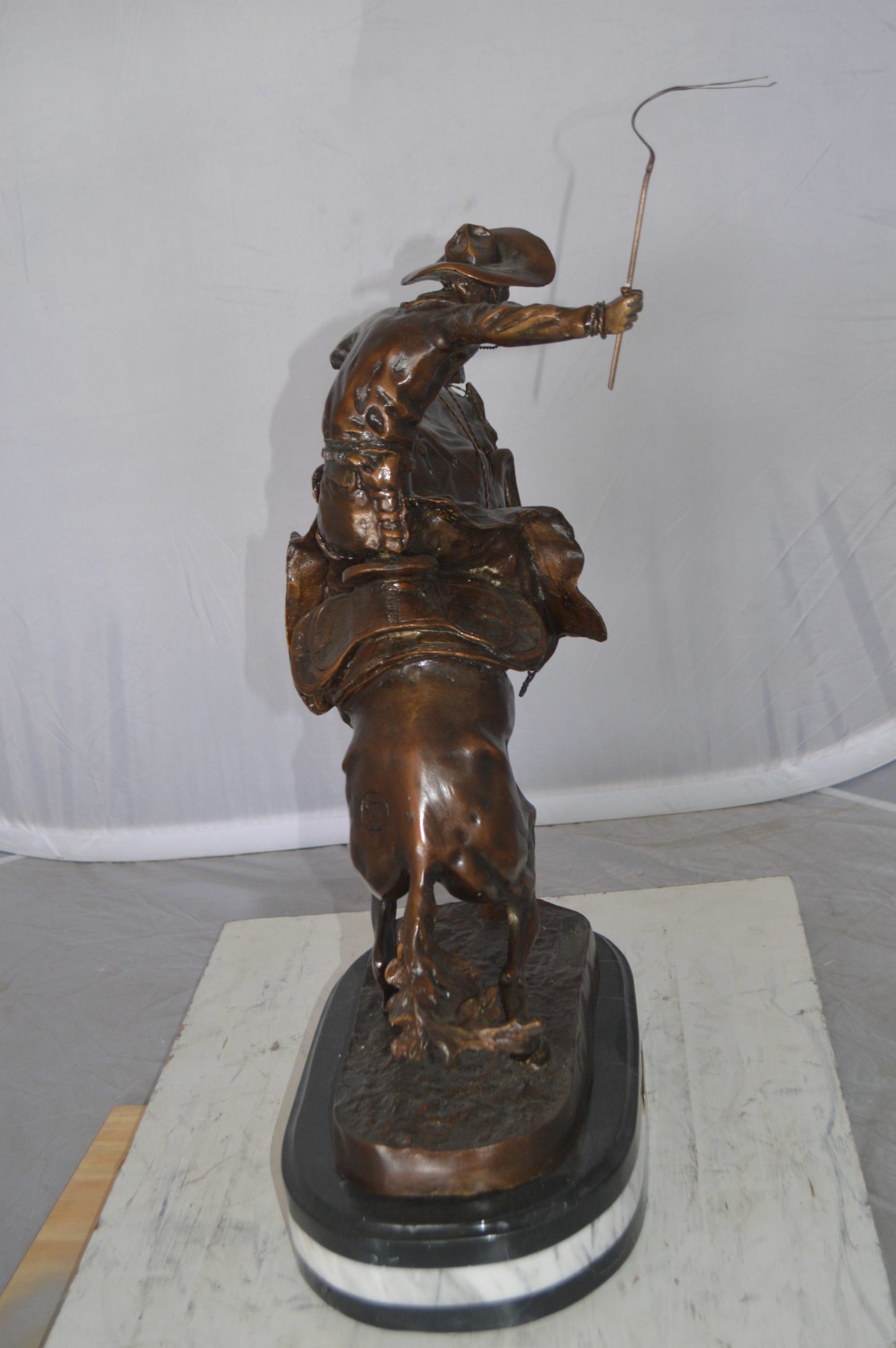 Bronco Buster by Remington Bronze Statue on a triple marble - 21"x 10"x 26"H.