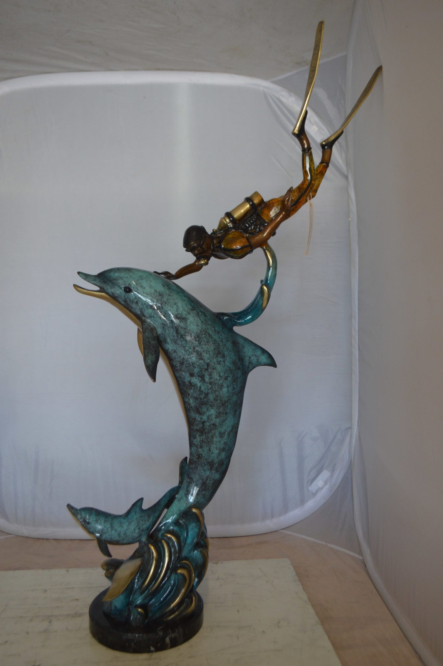 Diver With Dolphin Bronze Statue - Size: 10"L x 30"W x 49"H.