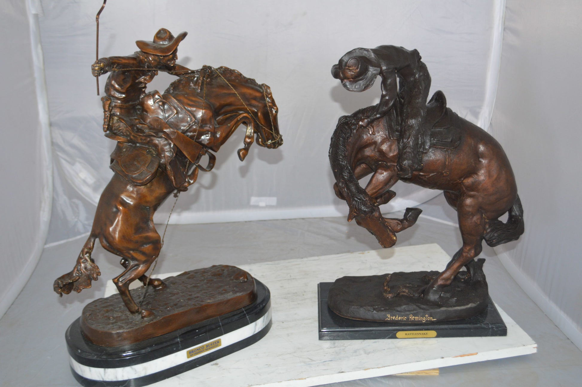 Bronco Buster by Remington Bronze Statue on a triple marble -  21"x 10"x 26"H.